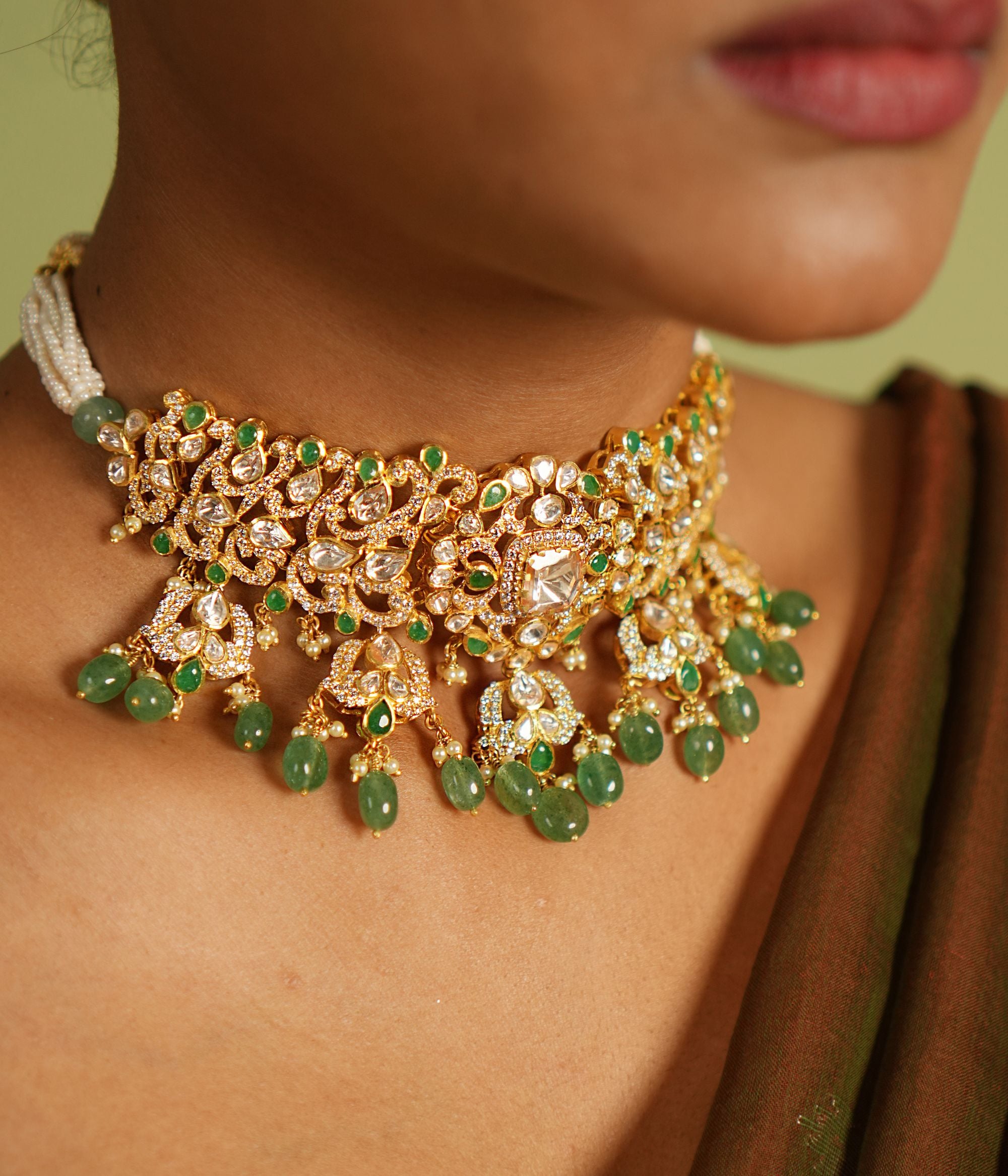 Elegant silver necklace with a gold-plated finish, adorned with intricate Polki stones, vibrant strawberry quartz, and sparkling CZ stones, creating a timeless and sophisticated design perfect for any occasion.