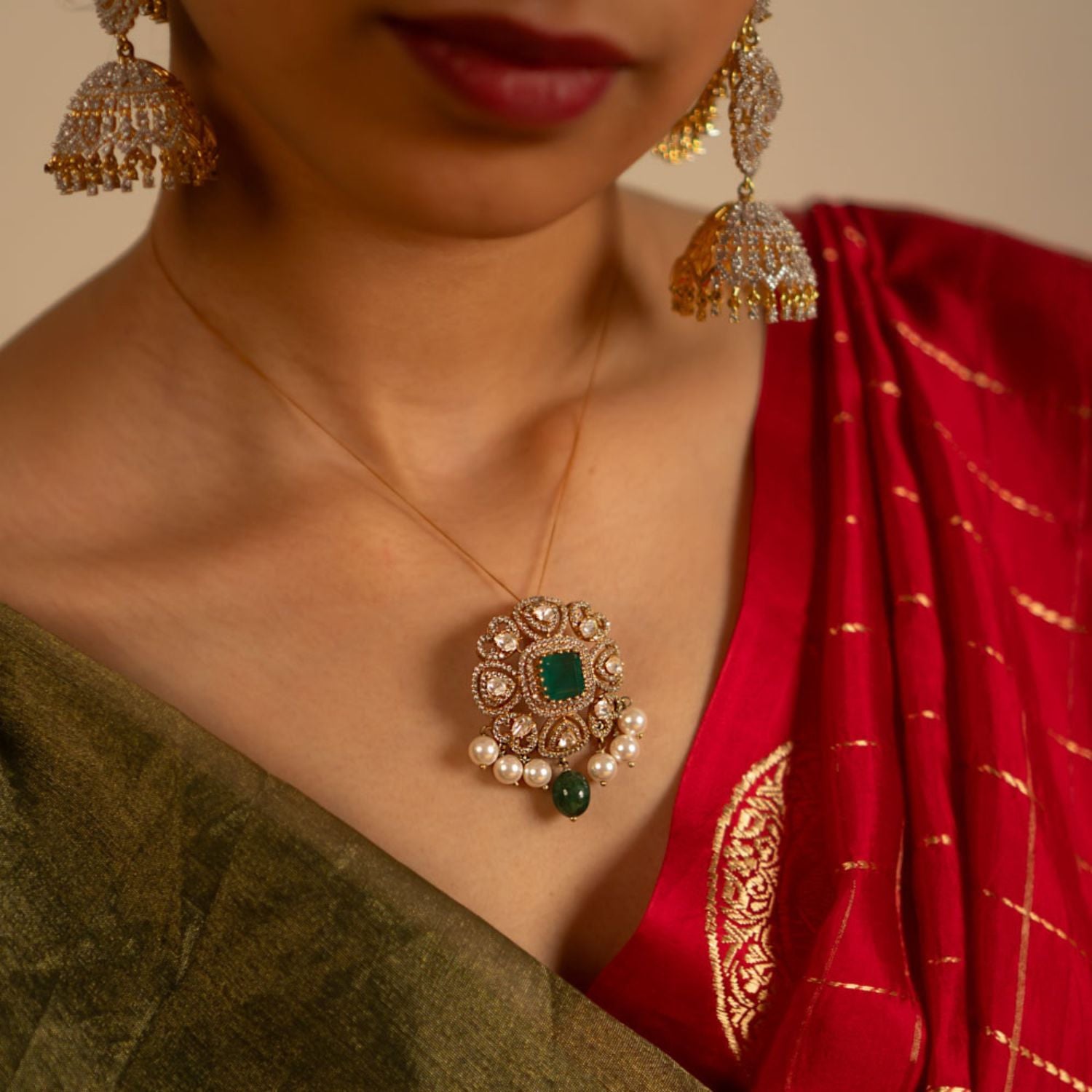 Eena Pendant in 92.5 Silver Dark Antique Gold with Polki and Green Stones