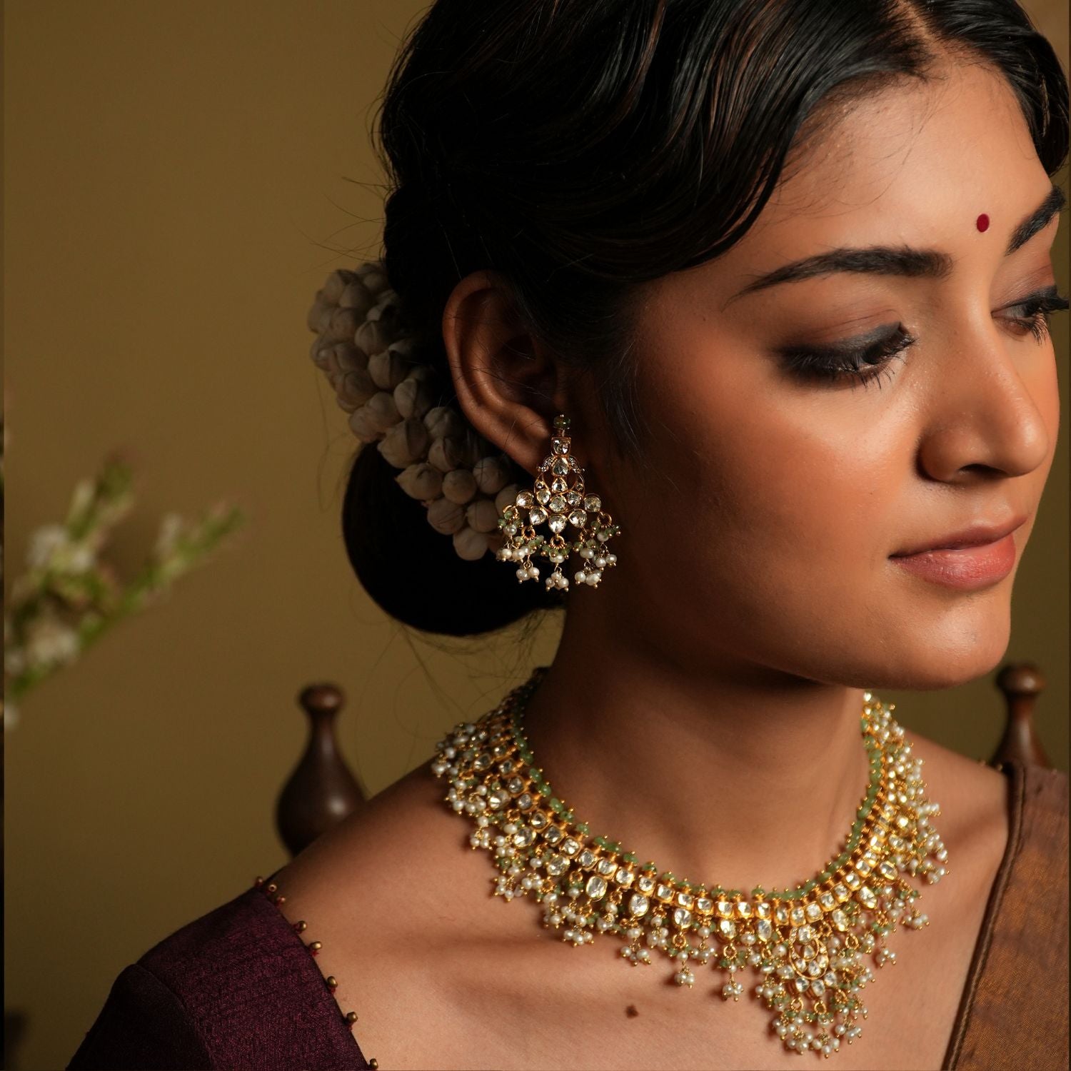 Elevate your elegance with these stunning moissanite Polki earrings, crafted with silver gold plating for a luxurious finish. Featuring intricately set hand-cut Polki stones, these earrings exude a regal charm with their dazzling brilliance and timeless appeal.