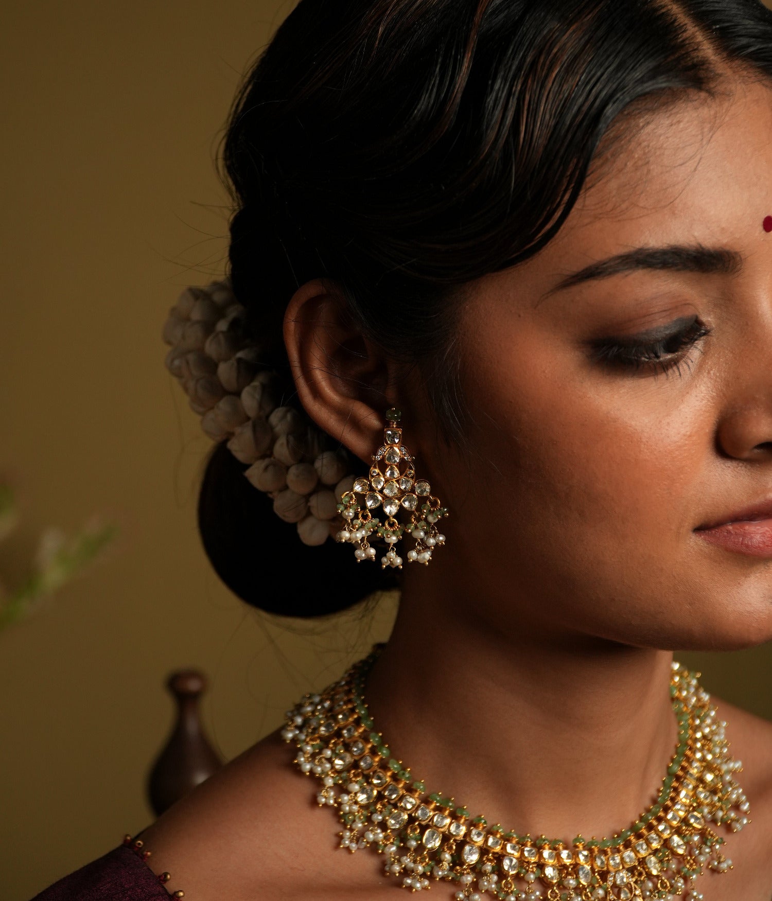 Elevate your elegance with these stunning moissanite Polki earrings, crafted with silver gold plating for a luxurious finish. Featuring intricately set hand-cut Polki stones, these earrings exude a regal charm with their dazzling brilliance and timeless appeal.