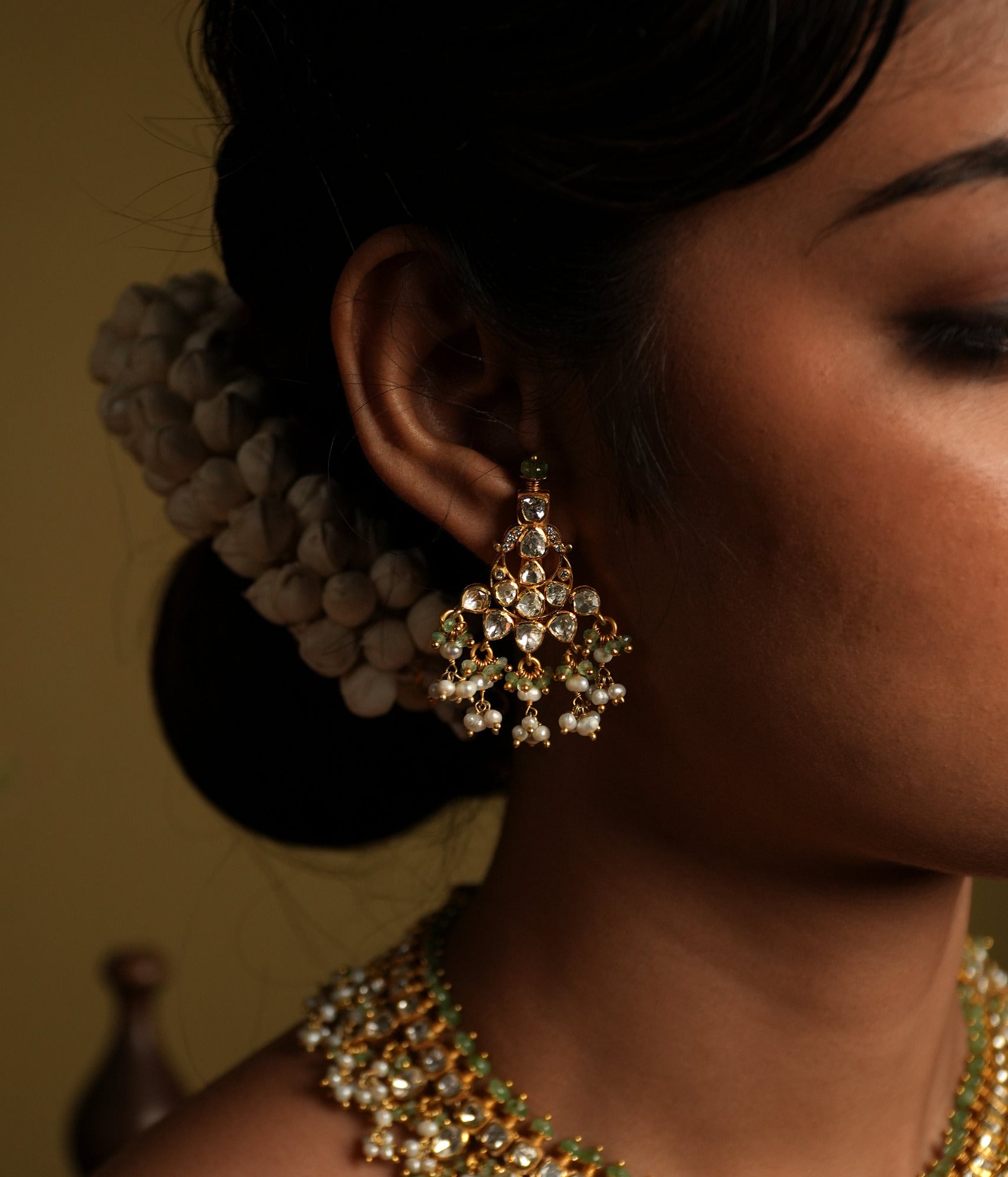 Elevate your elegance with these stunning moissanite Polki earrings, crafted with silver gold plating for a luxurious finish. Featuring intricately set hand-cut Polki stones, these earrings exude a regal charm with their dazzling brilliance and timeless appeal.