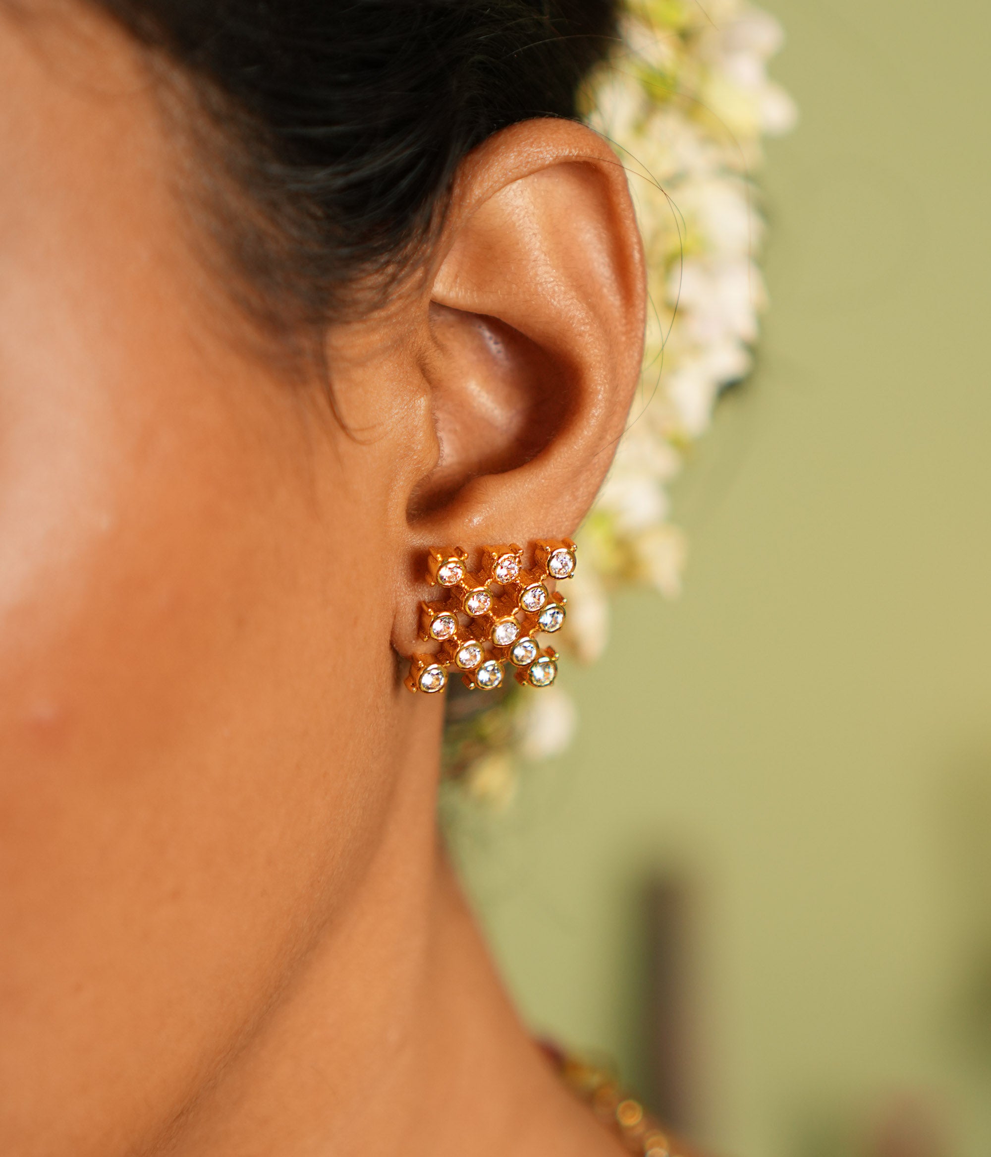Close-up of Gaia Earrings in sterling silver with sparkling CZ stones, handcrafted in Chennai