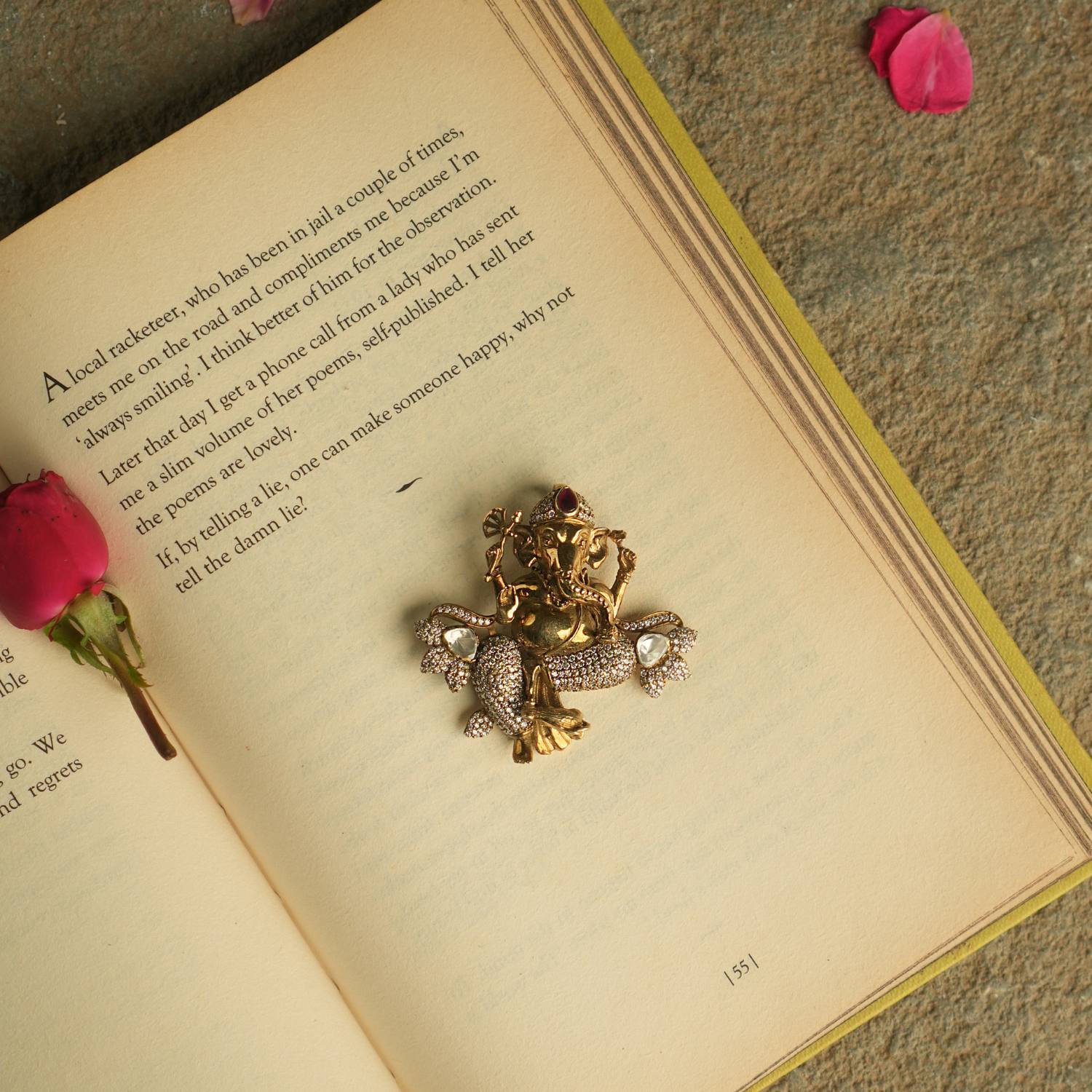 Adorn yourself with the sacred charm of this gold-plated silver pendant, featuring the revered Lord Ganesh motif, radiating grace and blessings.