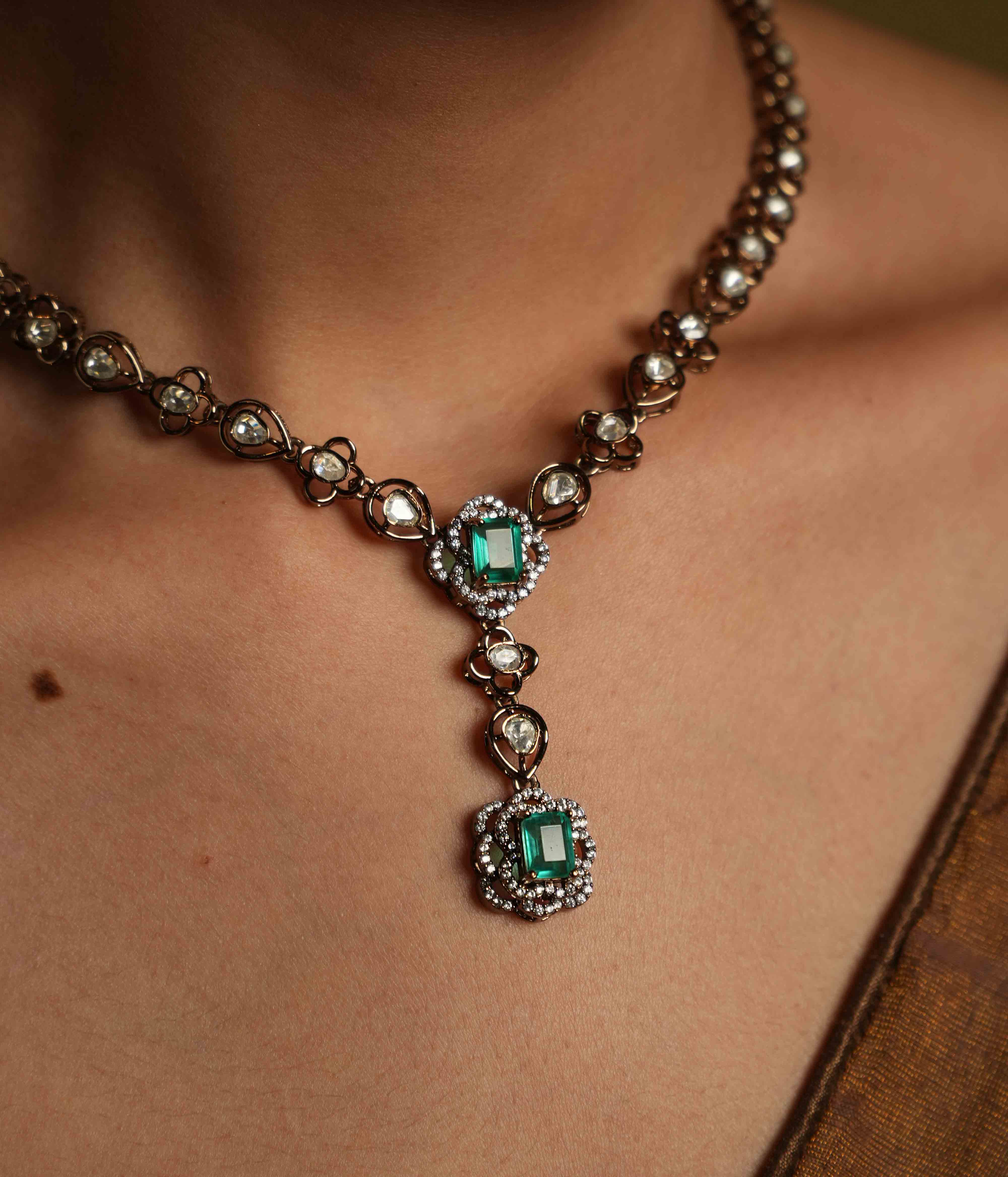Handmade Victorian-style necklace of 92.5 sterling silver with 14ct dark antique gold plating, featuring polki and CZ stones, accented with a green gemstone and a Victorian finish.