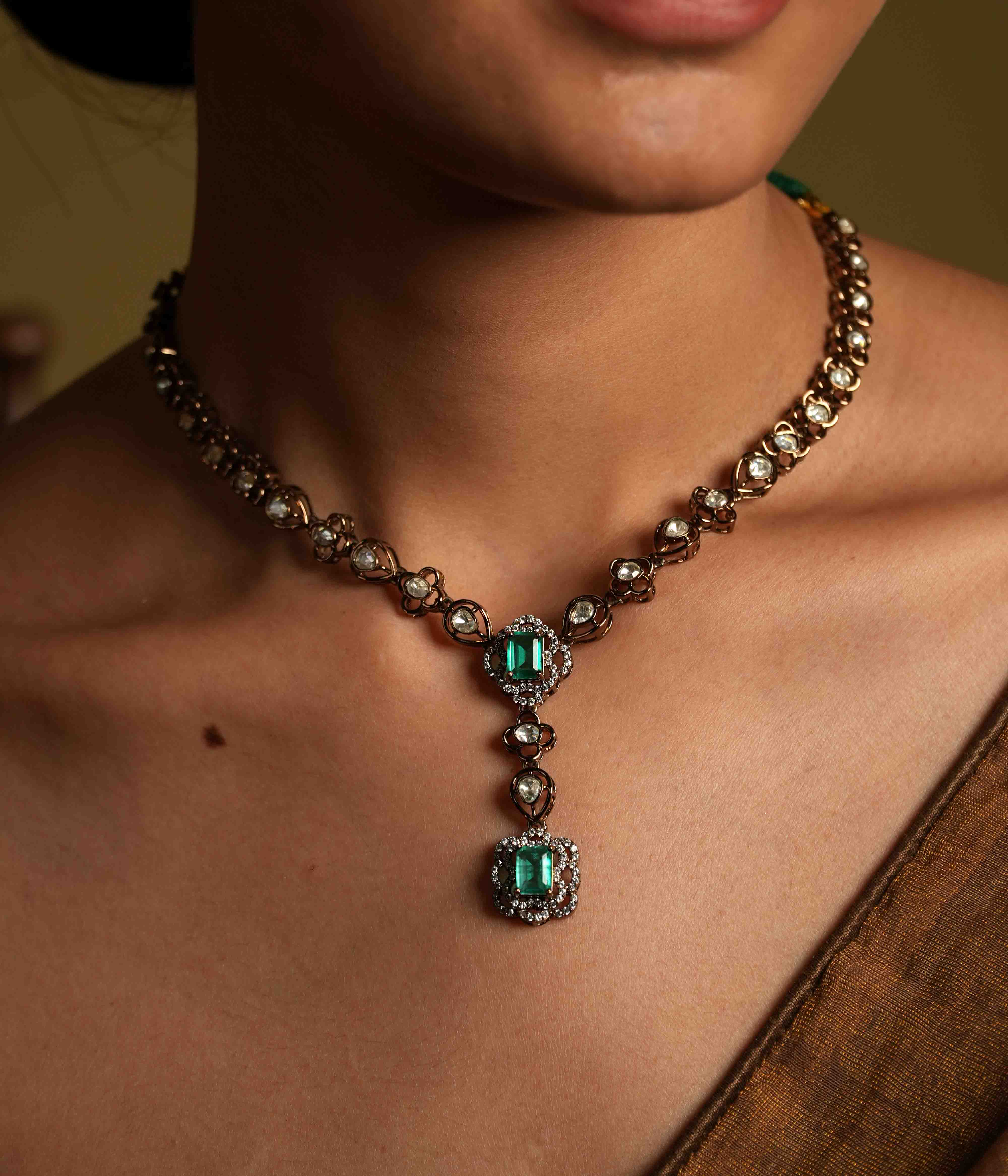 Handmade Victorian-style necklace of 92.5 sterling silver with 14ct dark antique gold plating, featuring polki and CZ stones, accented with a green gemstone and a Victorian finish.