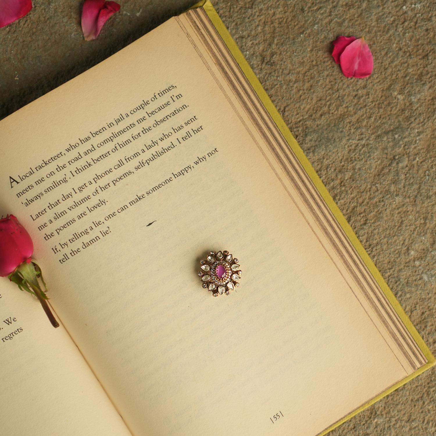 Add a touch of elegance to your collection with this round-shaped pendant, showcasing a captivating pink garnet at its center, encircled by shimmering Polki and CZ stones. Crafted with meticulous attention to detail, this pendant highlights the beauty of Polki while capturing the delicate charm of a natural pink garnet.