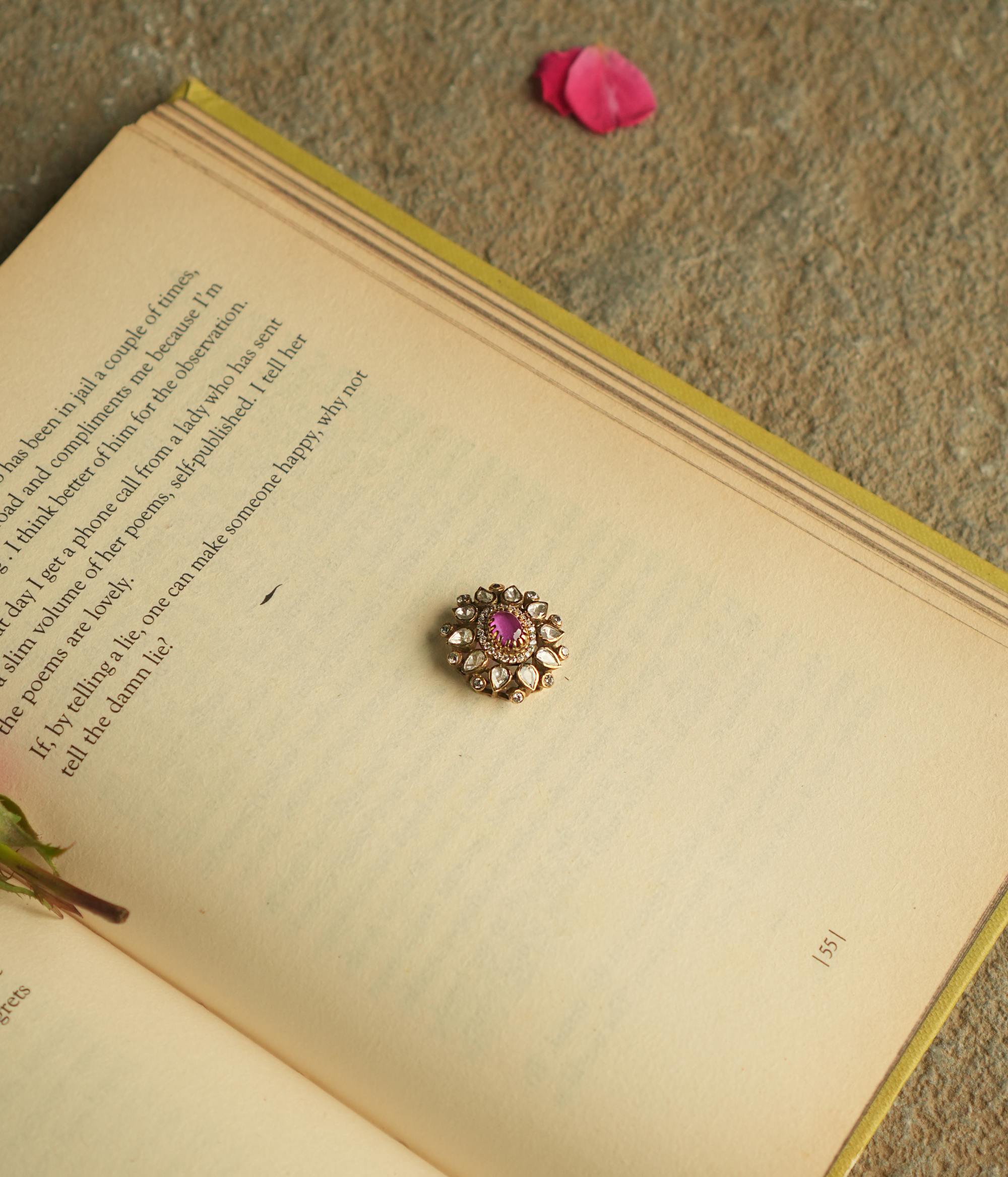 Add a touch of elegance to your collection with this round-shaped pendant, showcasing a captivating pink garnet at its center, encircled by shimmering Polki and CZ stones. Crafted with meticulous attention to detail, this pendant highlights the beauty of Polki while capturing the delicate charm of a natural pink garnet.