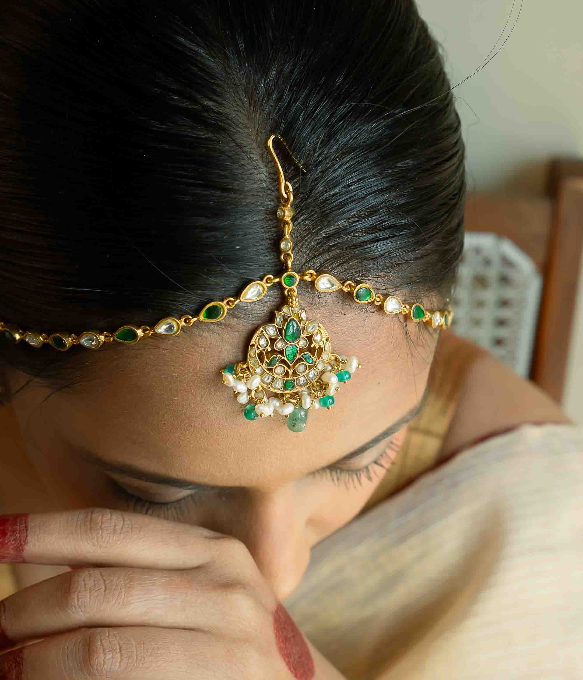 Traditional Indian bridal Mathapatti with pearls and green beads