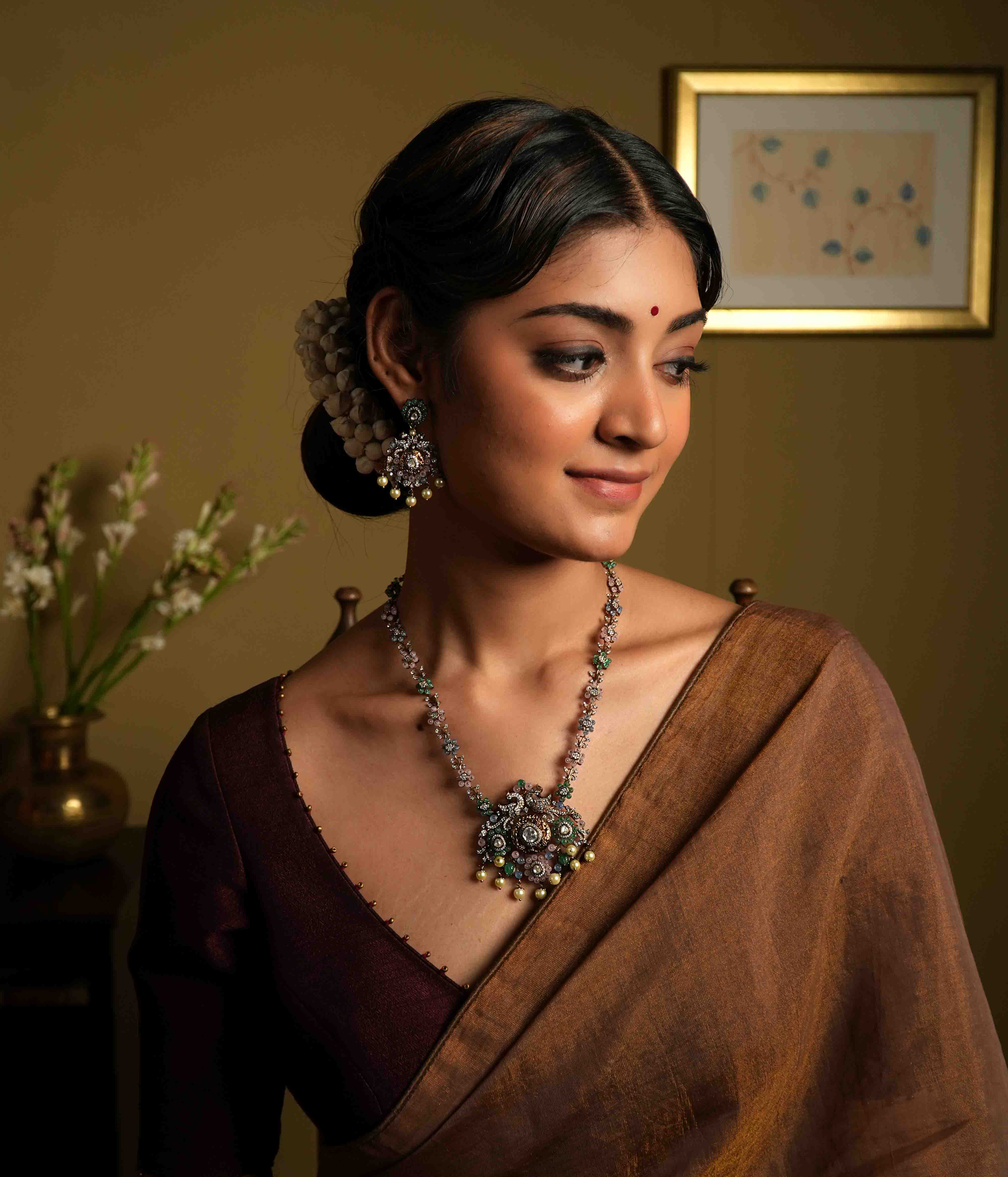A handcrafted 92.5 sterling silver and 14ct dark antique gold-plated necklace, featuring CZ stones, polki stones, green beads, and pearls in a Victorian finish, showcasing intricate floral designs and a show-stopping double peacock moissanite pendant.