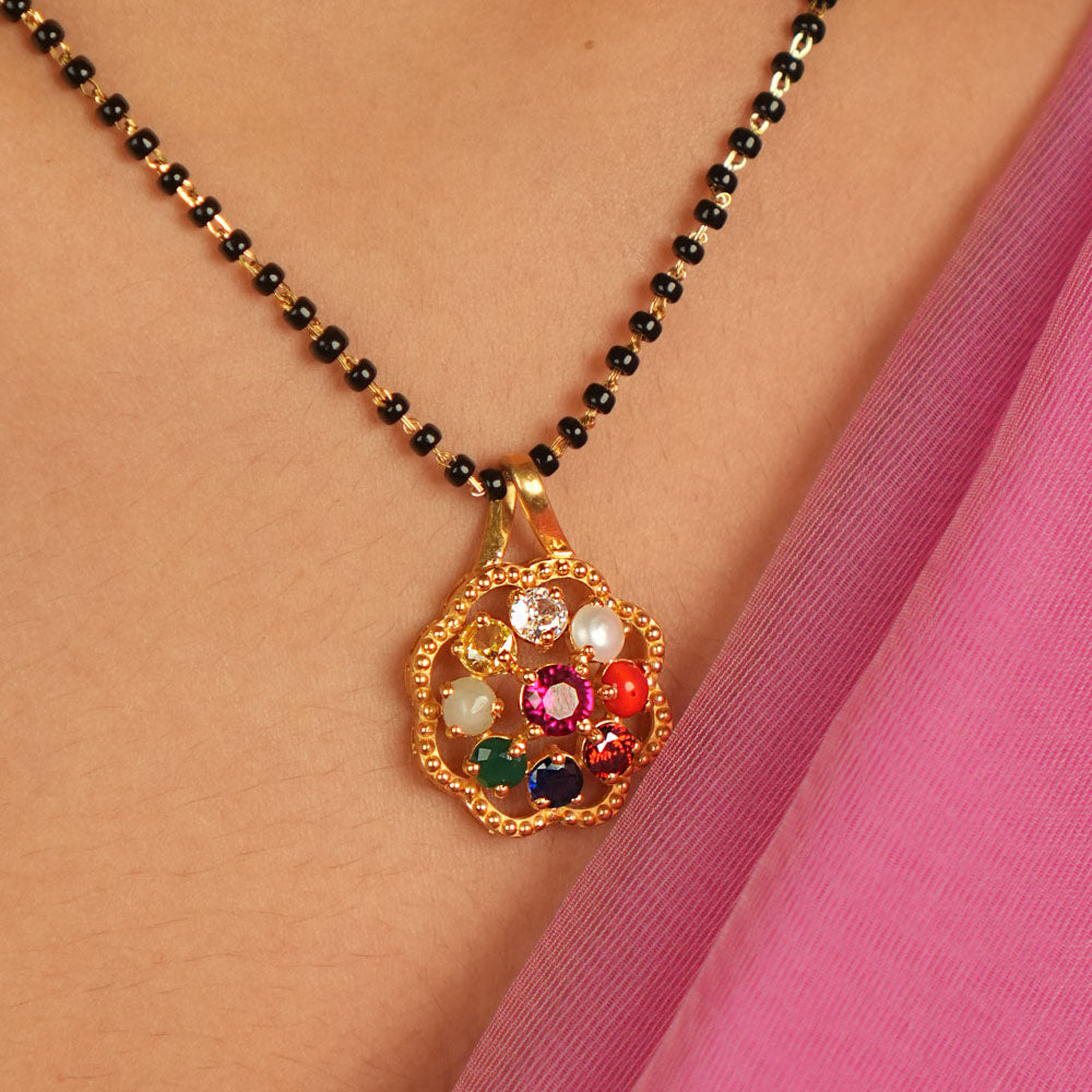 Celestial harmony in a gem. Navratna and Moissanite pendant: A vibrant symphony of colors, blending earthly desires with divine wisdom.