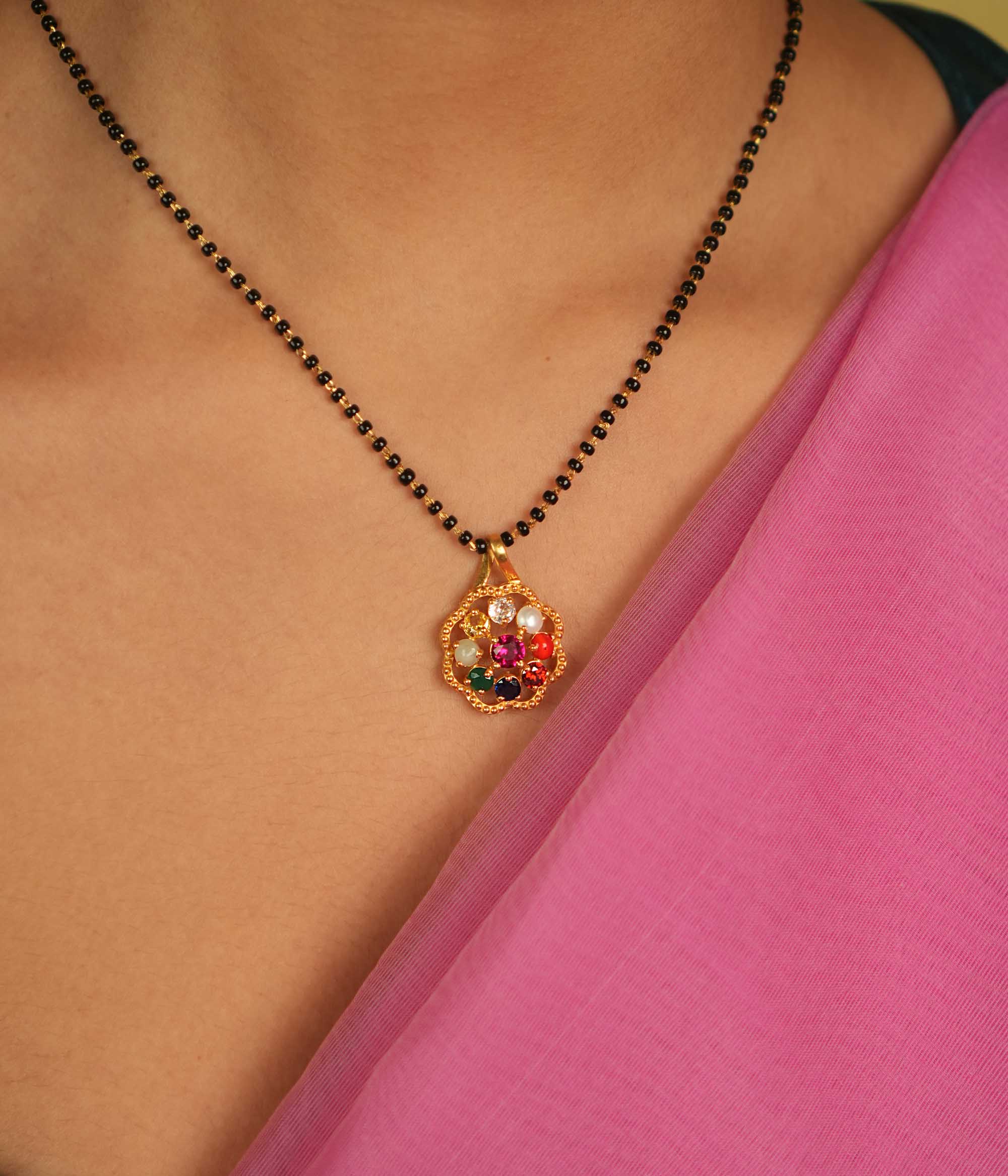 Celestial harmony in a gem. Navratna and Moissanite pendant: A vibrant symphony of colors, blending earthly desires with divine wisdom.