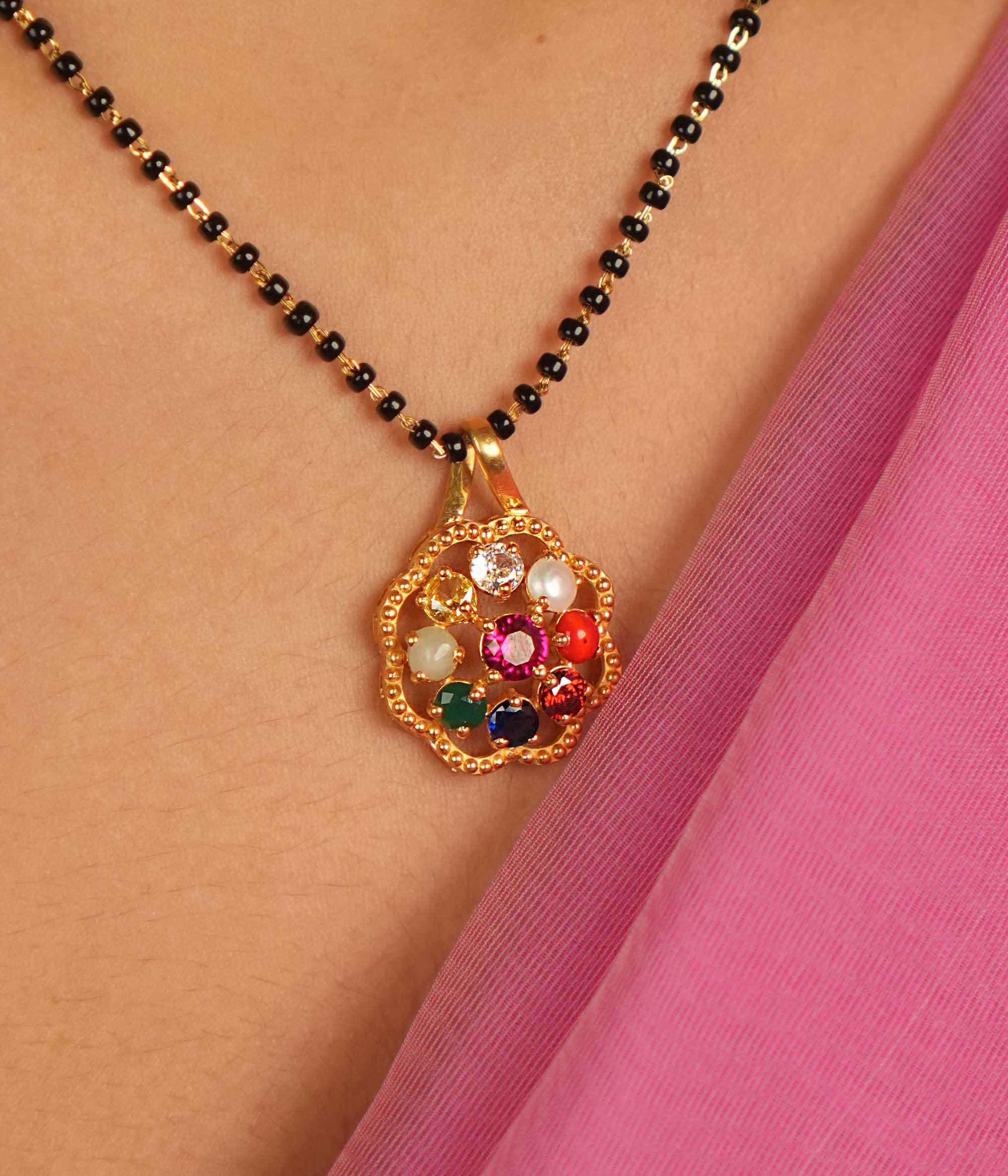 Celestial harmony in a gem. Navratna and Moissanite pendant: A vibrant symphony of colors, blending earthly desires with divine wisdom.