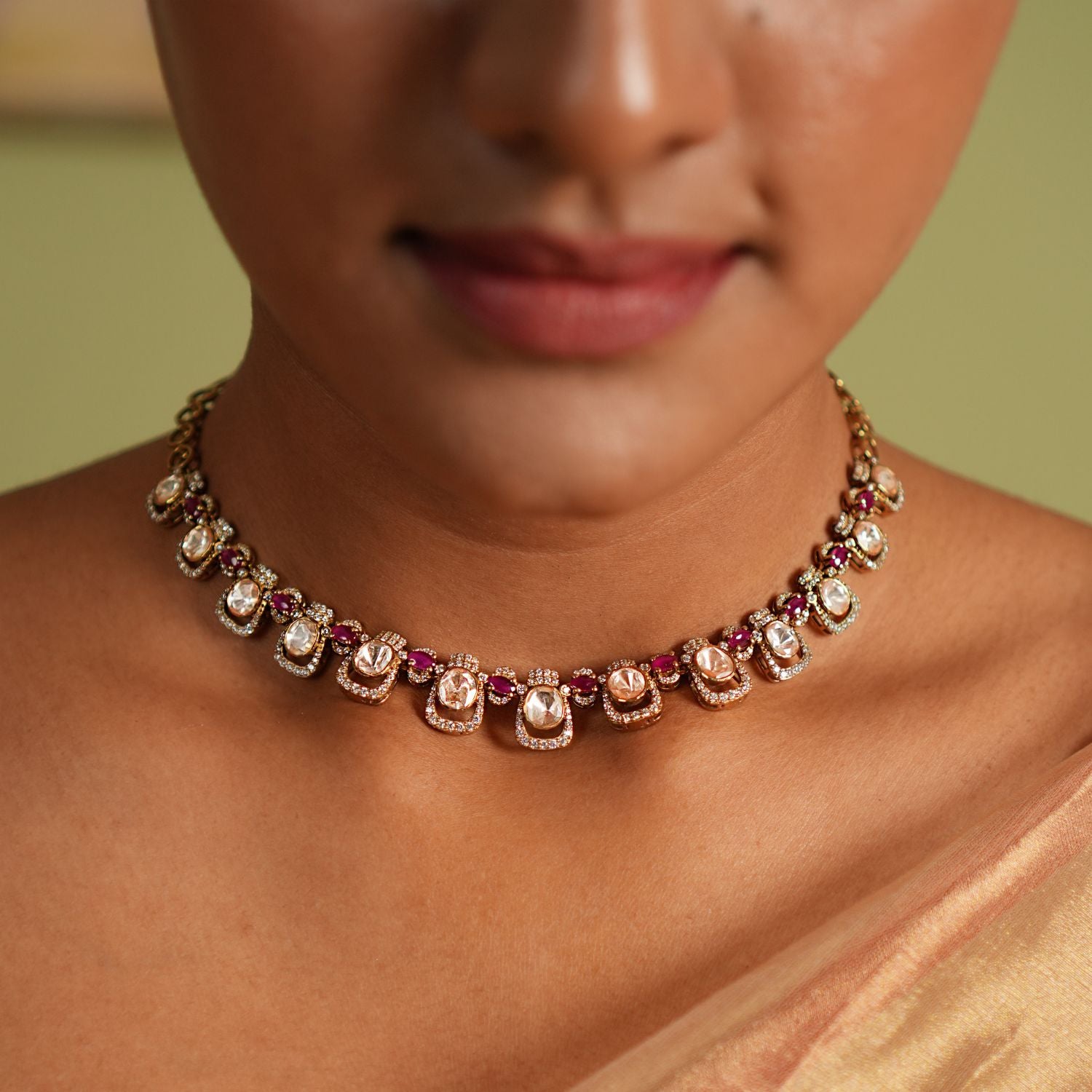 Graceful silver necklace with gold plating, adorned with dazzling Moissanite Polki stones, sparkling CZ stones, and exquisite pink tourmaline cut stones, crafted to enhance elegance and elevate your style for any occasion.