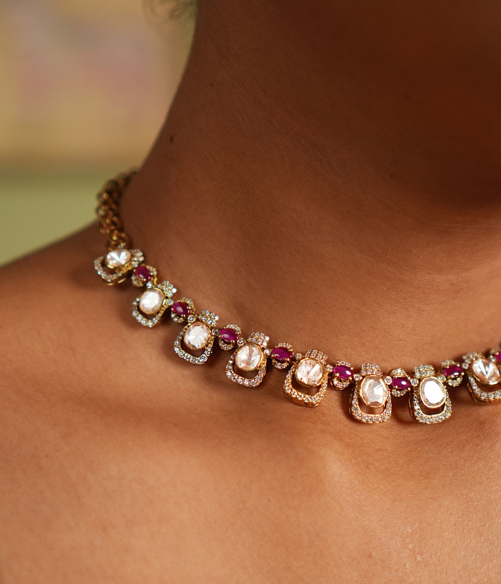 Graceful silver necklace with gold plating, adorned with dazzling Moissanite Polki stones, sparkling CZ stones, and exquisite pink tourmaline cut stones, crafted to enhance elegance and elevate your style for any occasion.