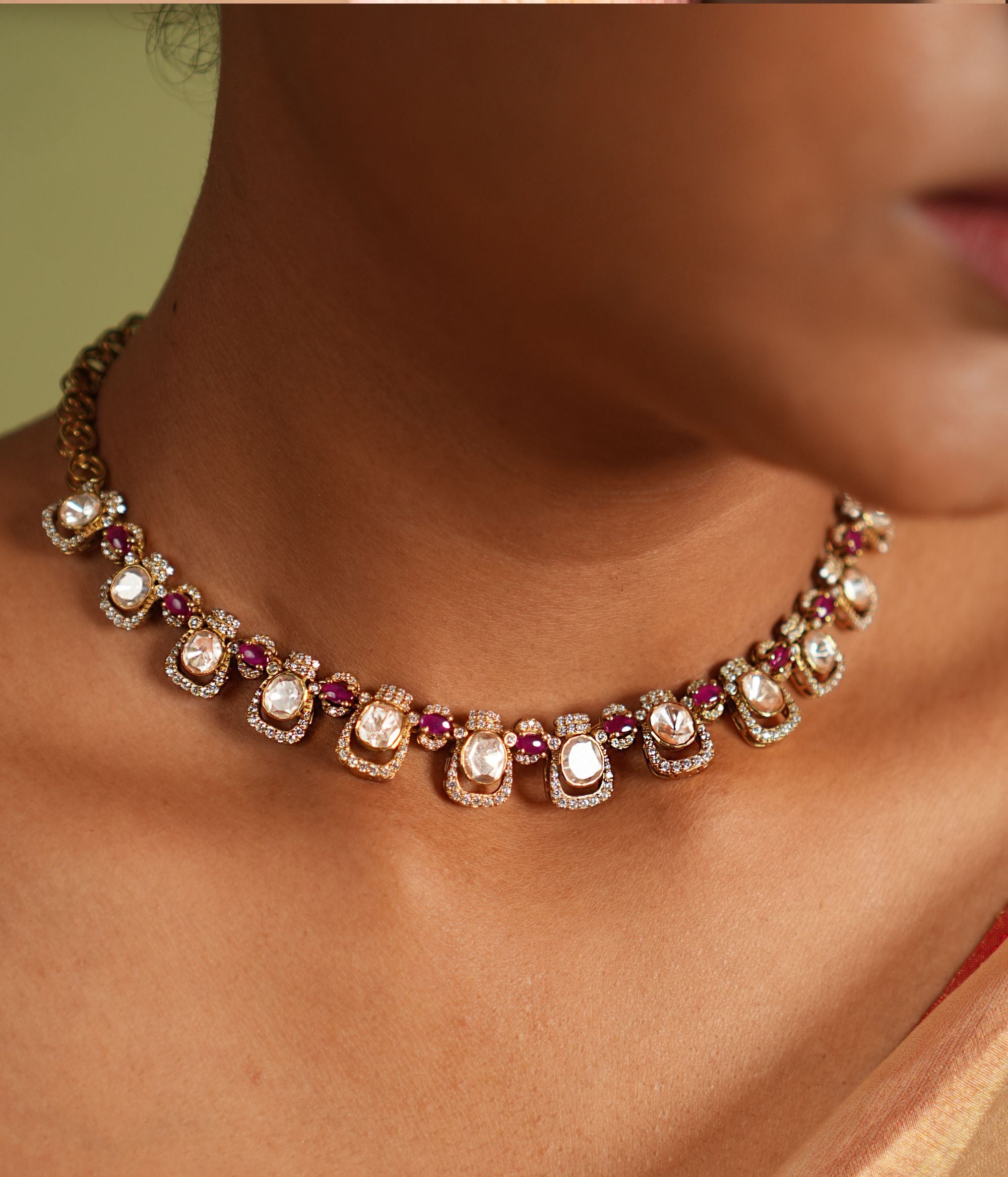 Graceful silver necklace with gold plating, adorned with dazzling Moissanite Polki stones, sparkling CZ stones, and exquisite pink tourmaline cut stones, crafted to enhance elegance and elevate your style for any occasion.