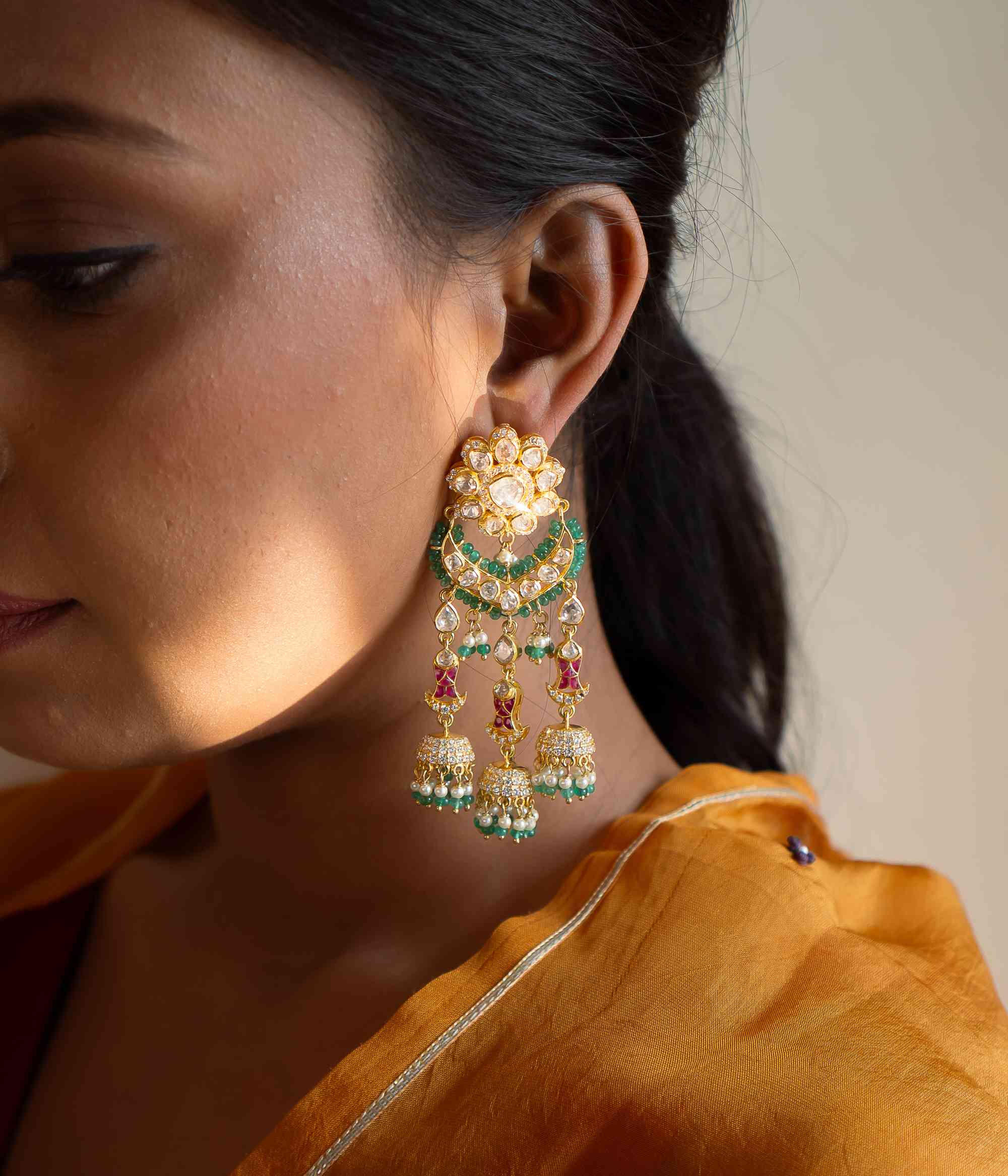 Handcrafted Polki earrings with green beads and CZ stones