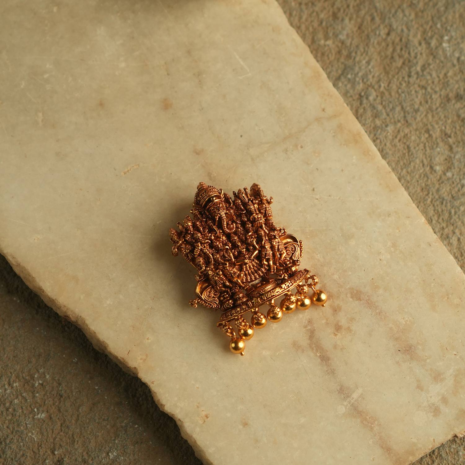 Embrace prosperity and conquer obstacles with graceful elegance in this beautifully handcrafted gold-plated silver pendant. At its heart, a serene depiction of Lord Ram, Sita, and Lakshman embodies timeless devotion and harmony.