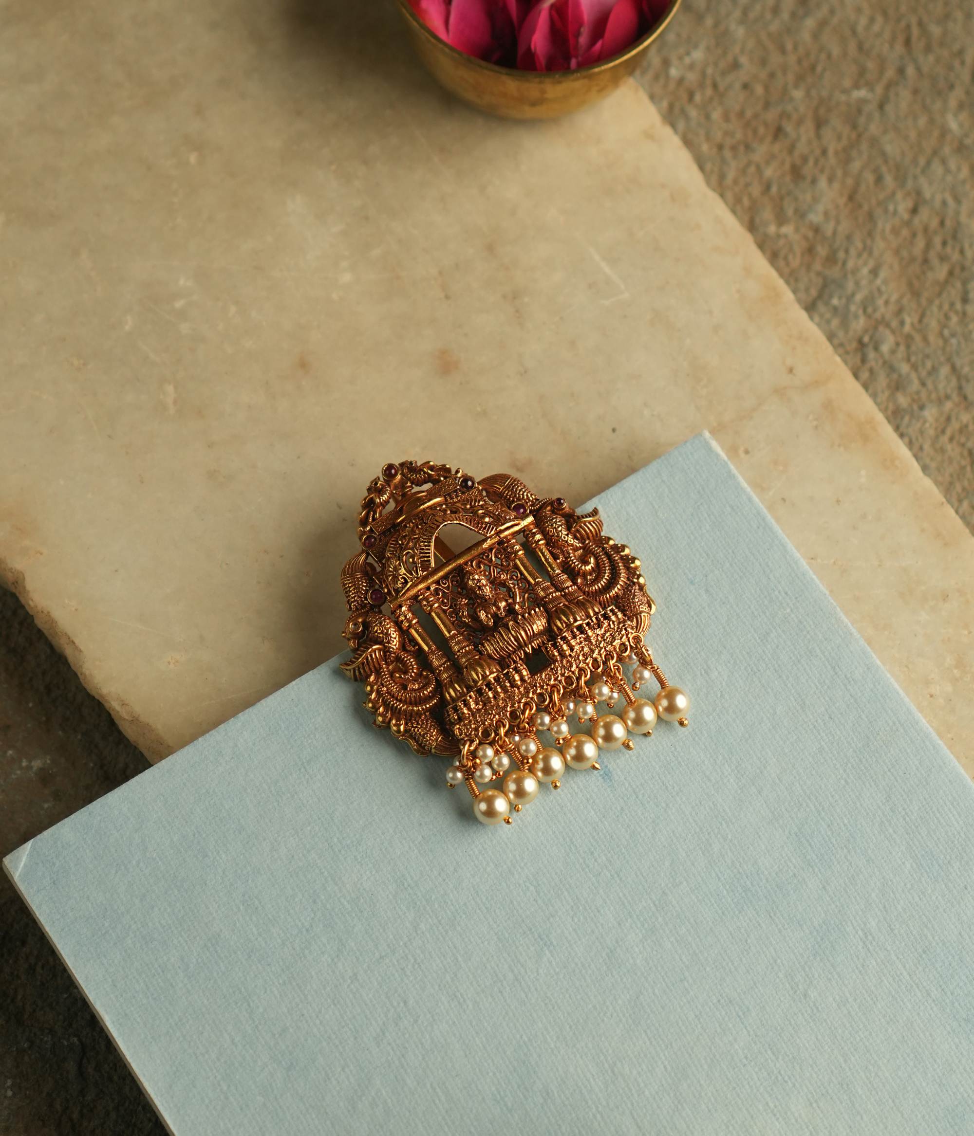 Close-up of Hiranmayi Nakshi silver pendant showing intricate handcrafted work