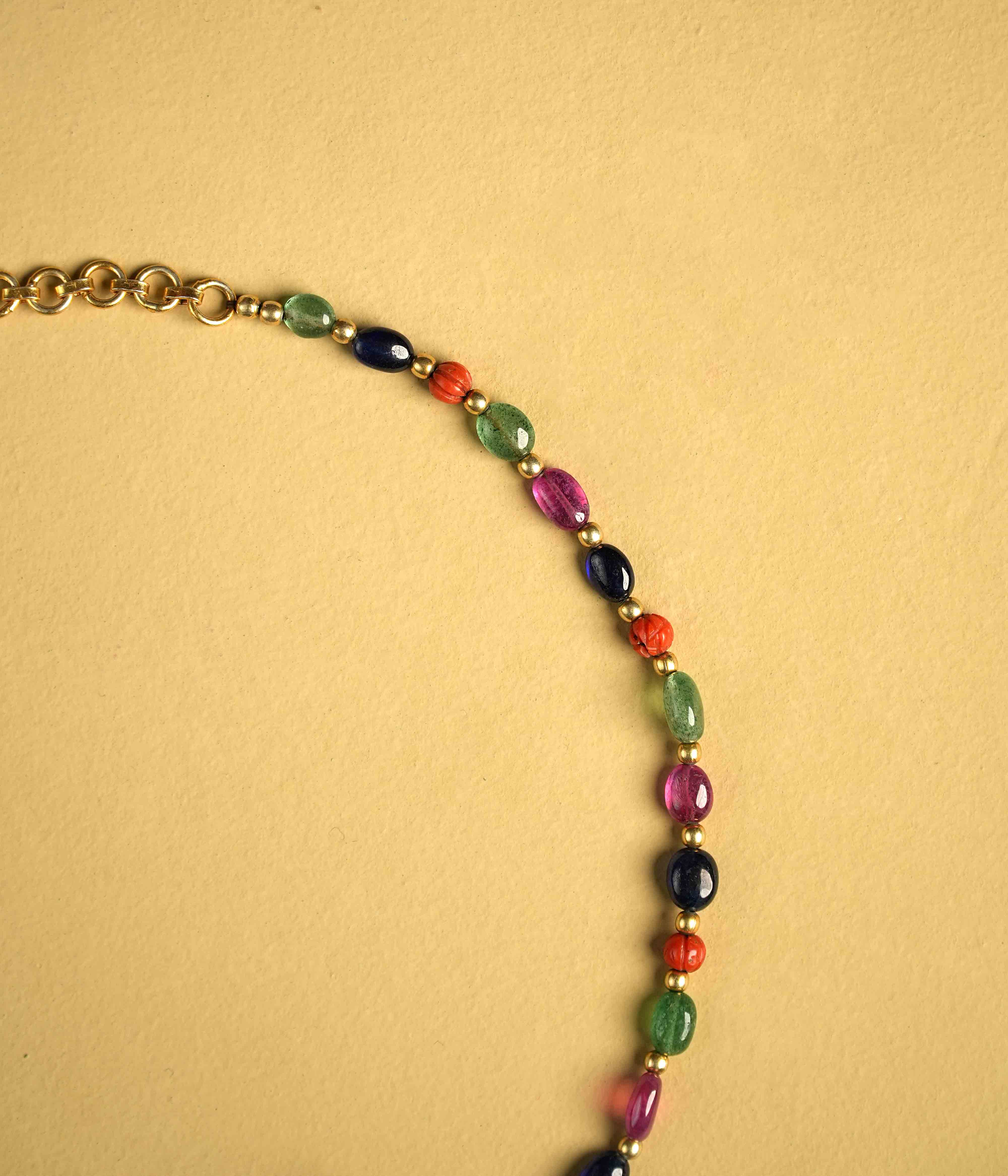 Regal 92.5 sterling silver choker featuring three bold, multi-hued natural gemstones. The stones are intricately engraved with vintage meenakari, inspired by the opulence of Rajput jewelry, exuding timeless elegance and commanding attention.
