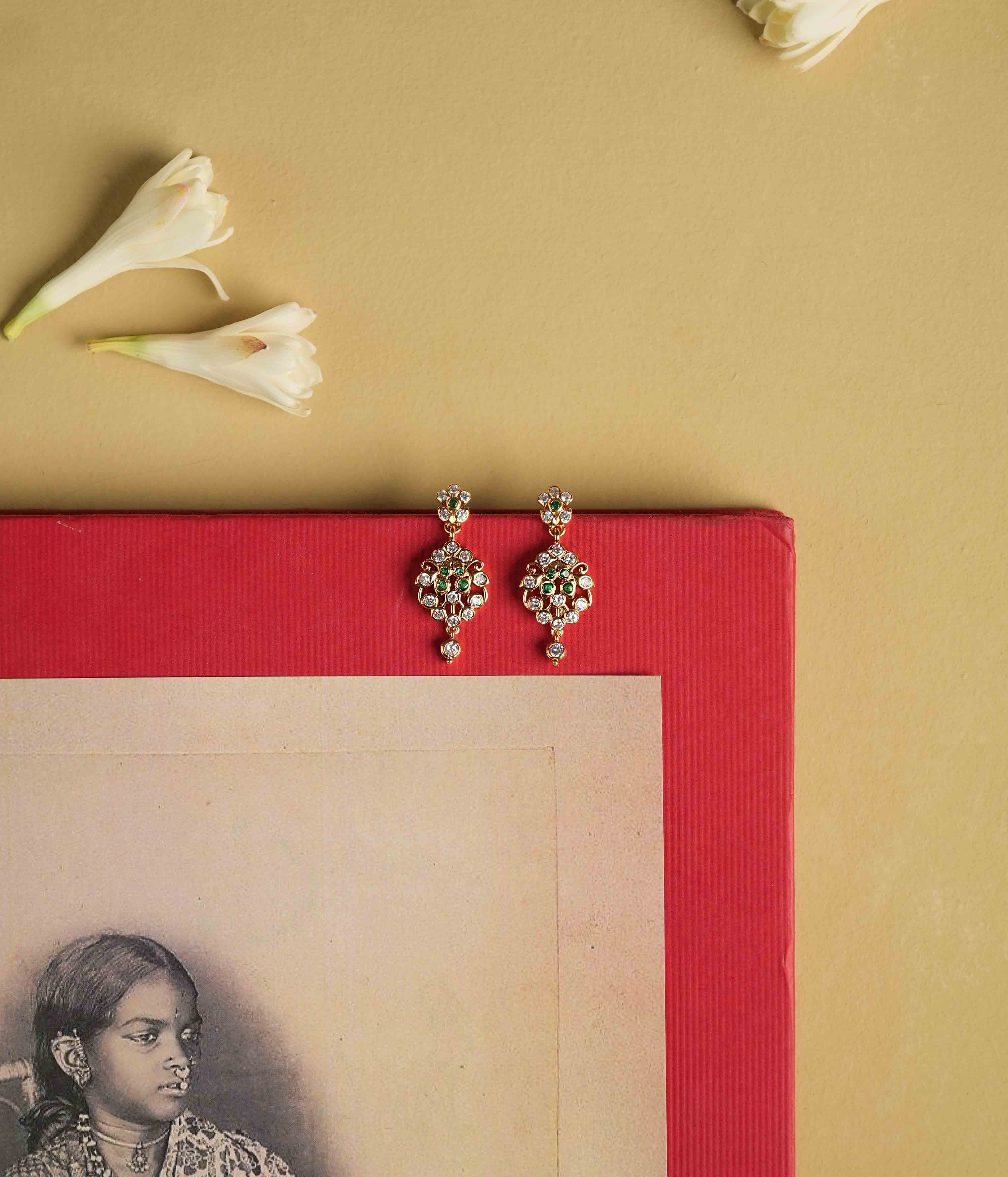 92.5 sterling silver earrings with South screw fastenings, featuring moissanite, green cut stones, and Swarovski crystals, inspired by the elegant heritage of Chettinad designs.