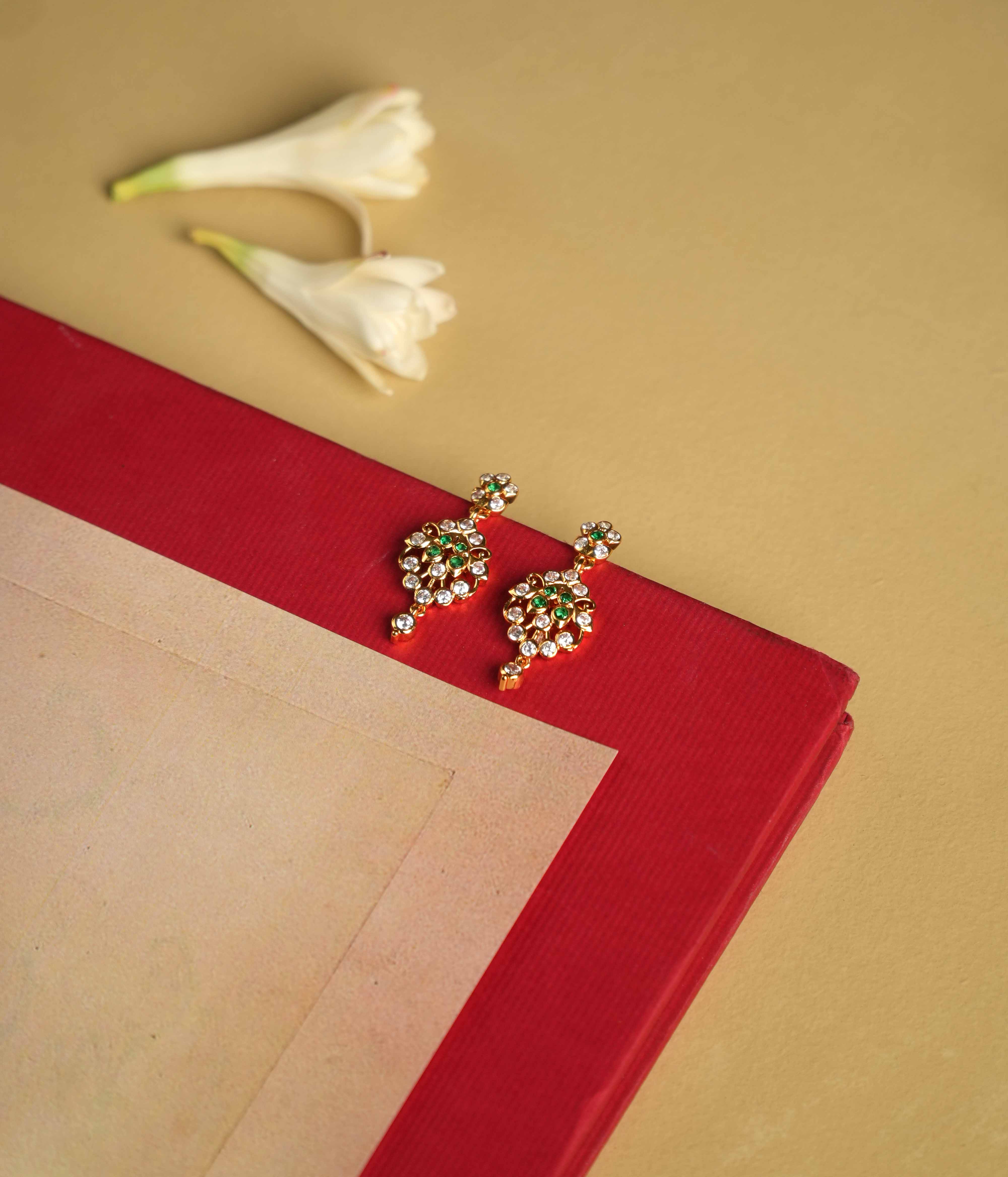 92.5 sterling silver earrings with South screw fastenings, featuring moissanite, green cut stones, and Swarovski crystals, inspired by the elegant heritage of Chettinad designs.