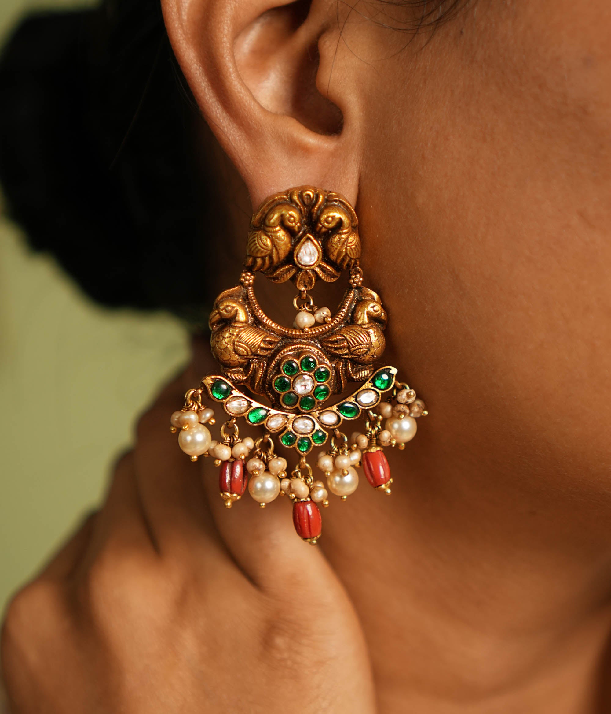Closeup of green and red kundan work