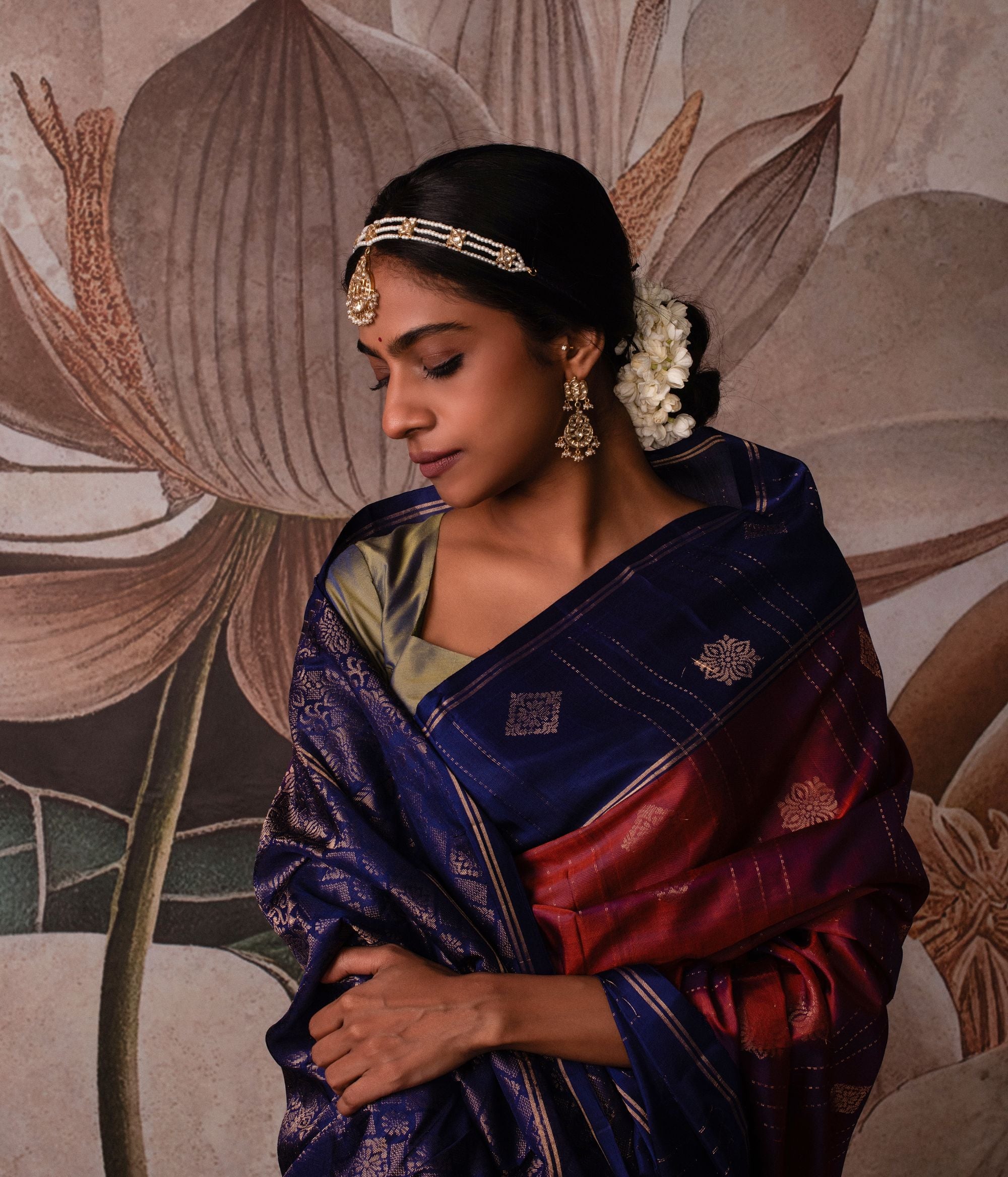 Gold-plated silver tikka featuring a delicate moon-shaped pendant, adorned with shimmering white sapphires and elegant pearls, exuding a timeless and graceful traditional charm.