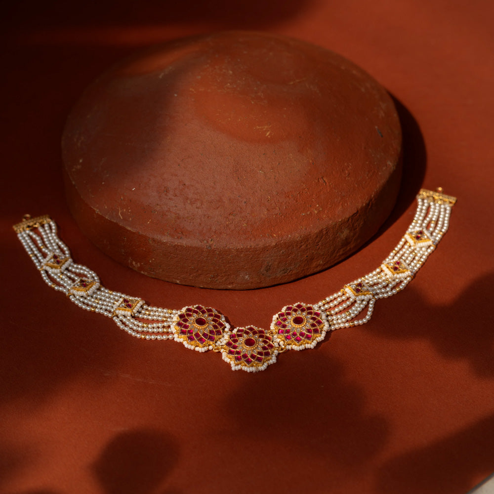 Elegant Ruby Bloom Pearl Choker in 92.5 Sterling Silver, featuring ruby-studded floral motifs and multiple strands of lustrous pearls with golden connectors.