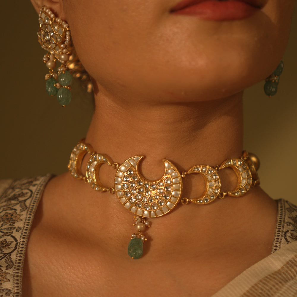Celestial-themed choker with moon and star motifs, adorned with polkis and Kundan stones.