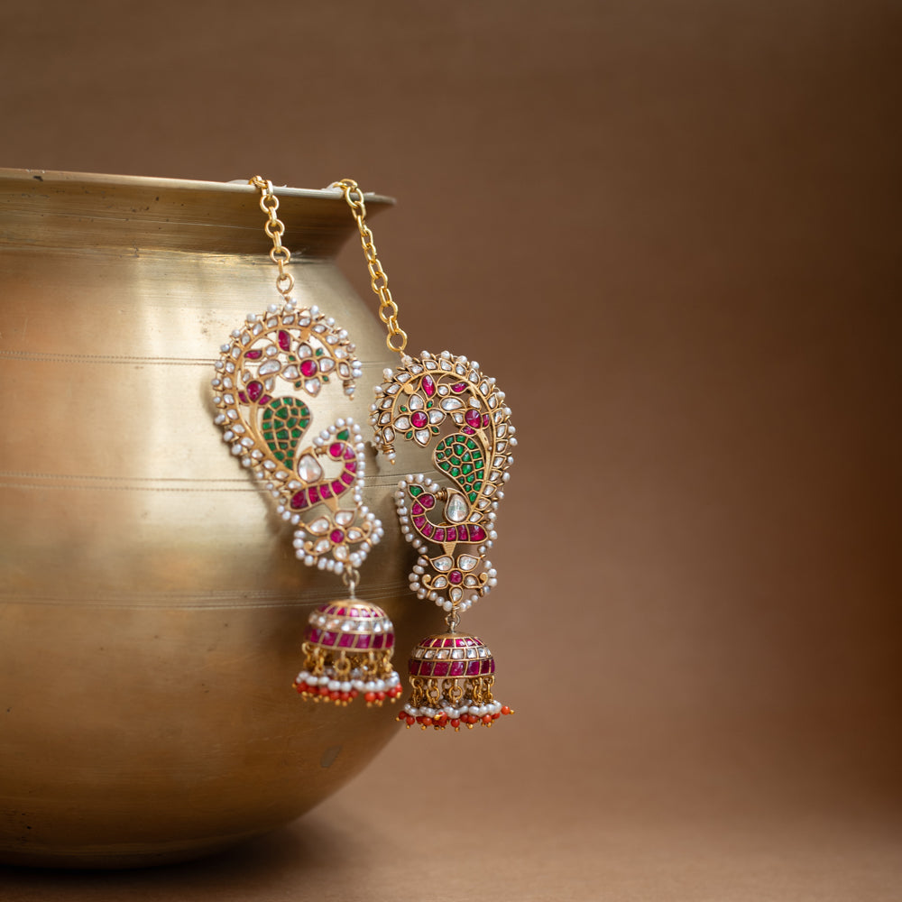 Kundan Collection paisley earrings with red, green, white kundan stones and pearl jhumka design.