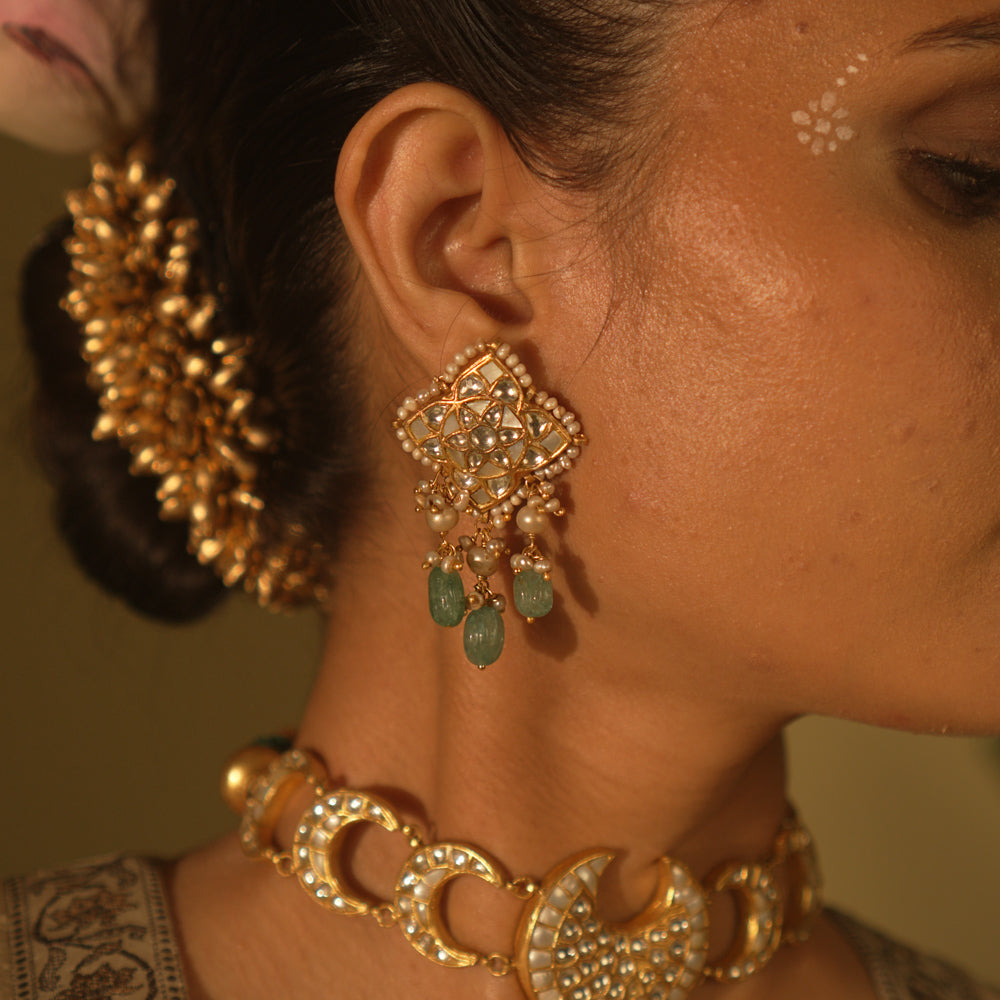 Galaxy-inspired Polki earrings with pearls and gemstones—cosmic charm in an artistic silhouette.