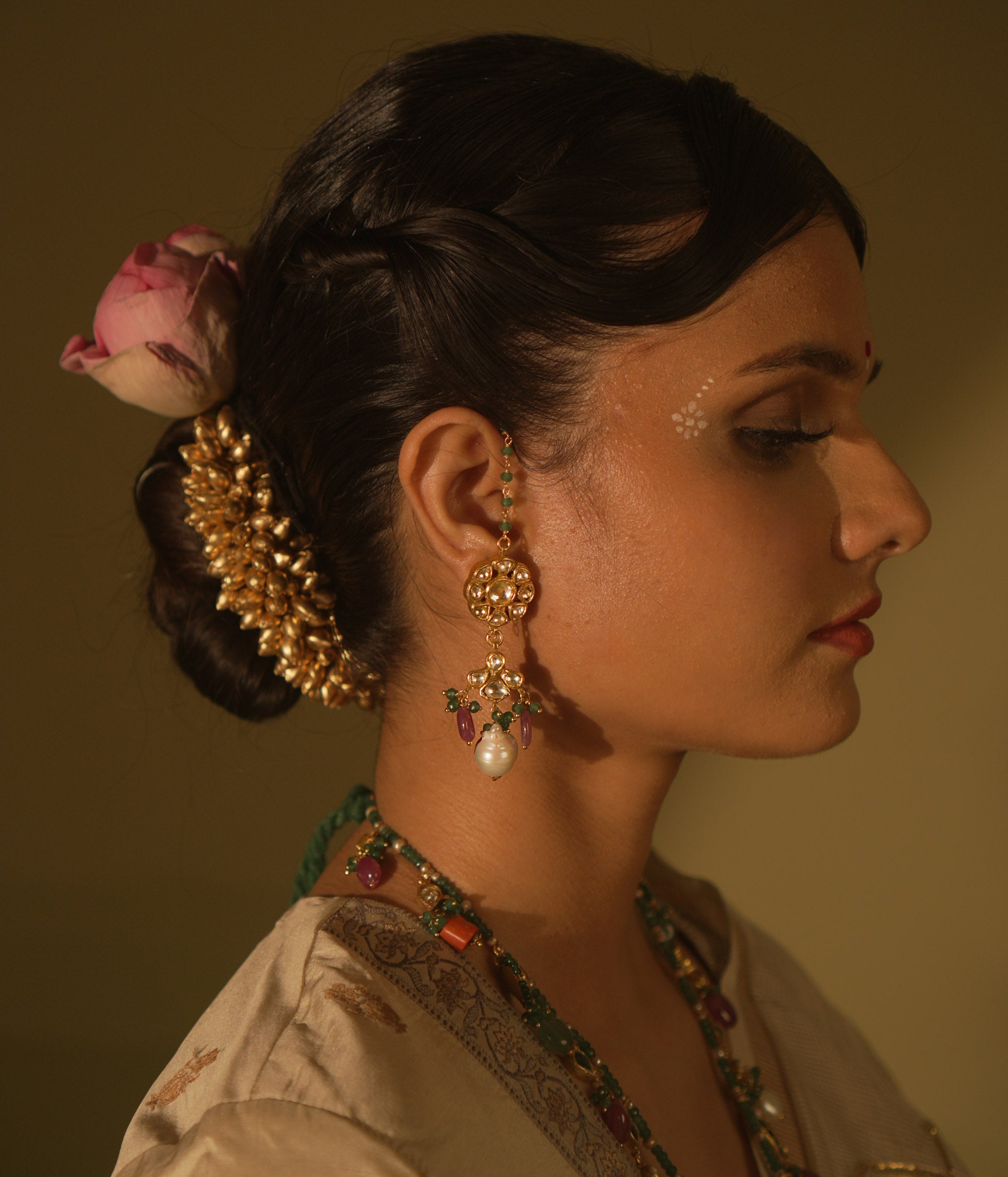 Nature-inspired Polki earrings with abstract buds and pearls—organic grace and luminous charm.