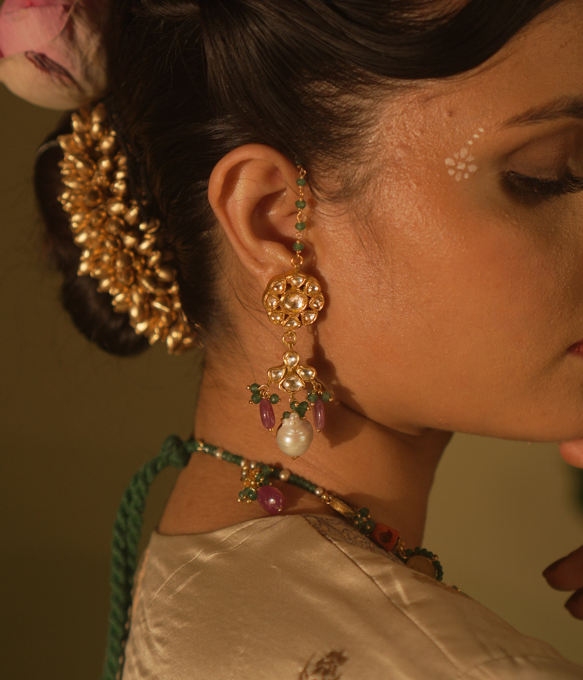 Nature-inspired Polki earrings with abstract buds and pearls—organic grace and luminous charm.