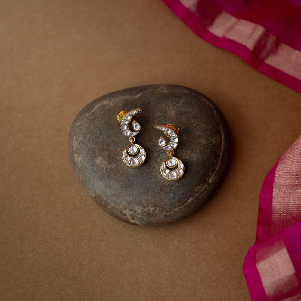 White Kundan stone earrings with crescent moon top and circular drop from Kundan Collection.