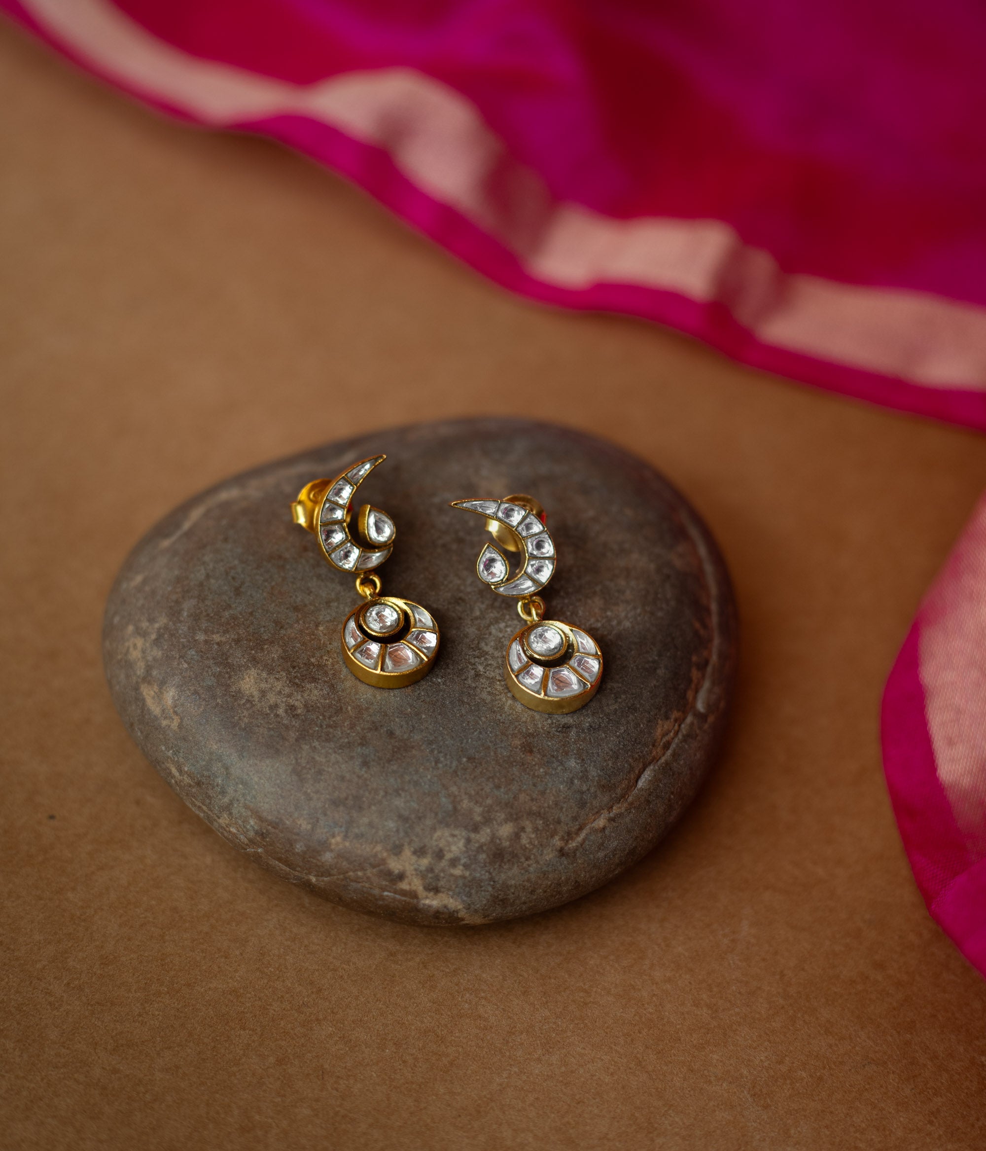White Kundan stone earrings with crescent moon top and circular drop from Kundan Collection.