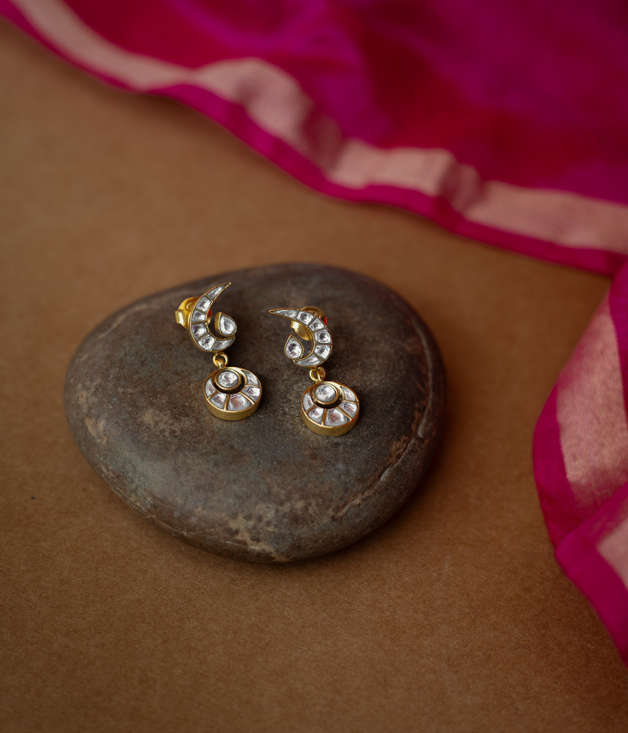 White Kundan stone earrings with crescent moon top and circular drop from Kundan Collection.