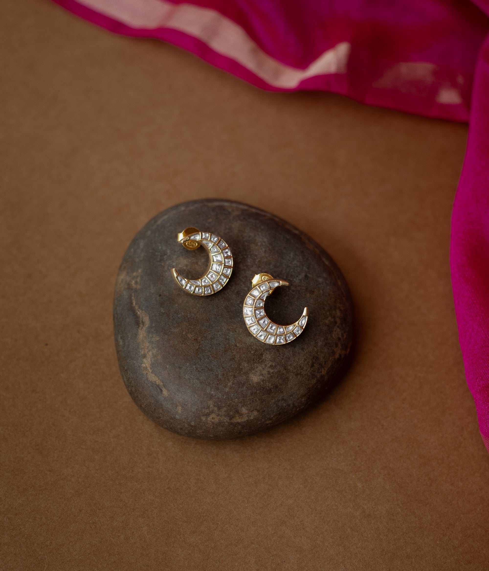 Gold crescent-shaped earrings studded with white Kundan stones from Kundan Collection, reflecting moonlight elegance.