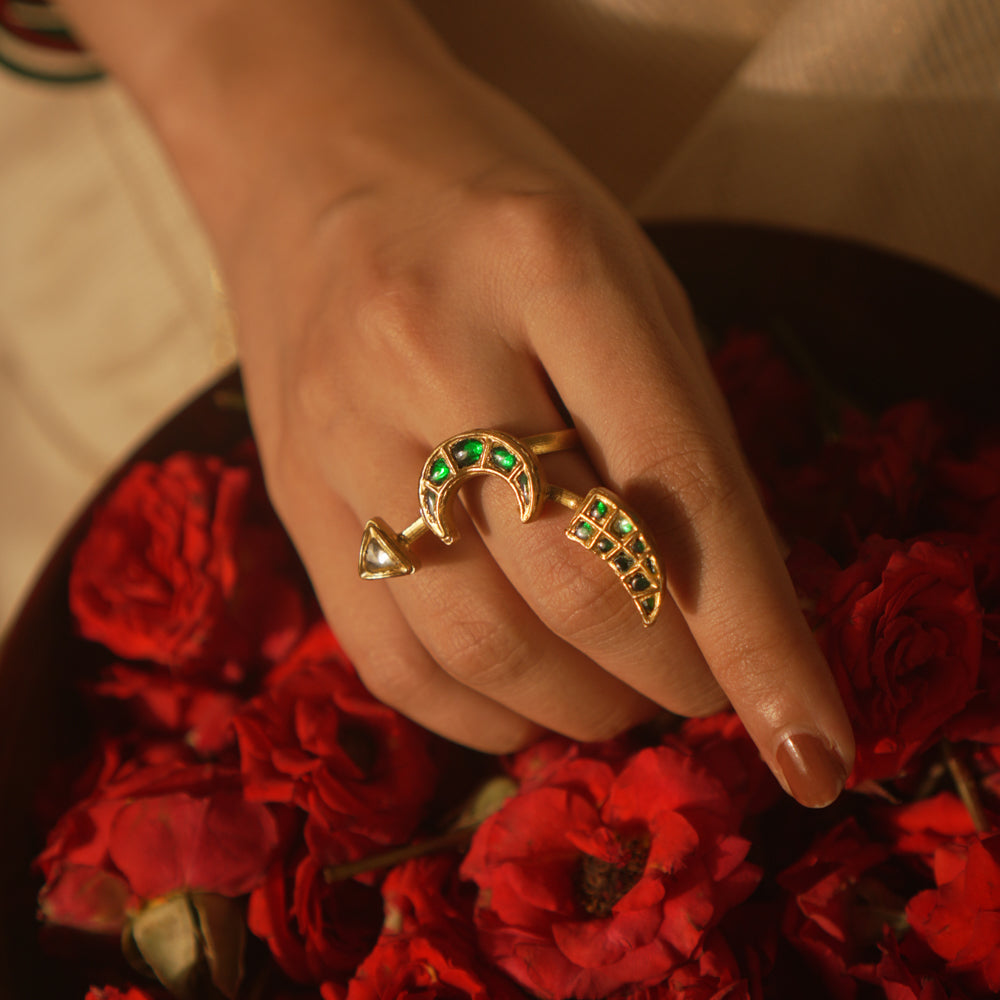 Crescent moon ring with green Kundan and tusk motif—symbolic, graceful, and timeless.
