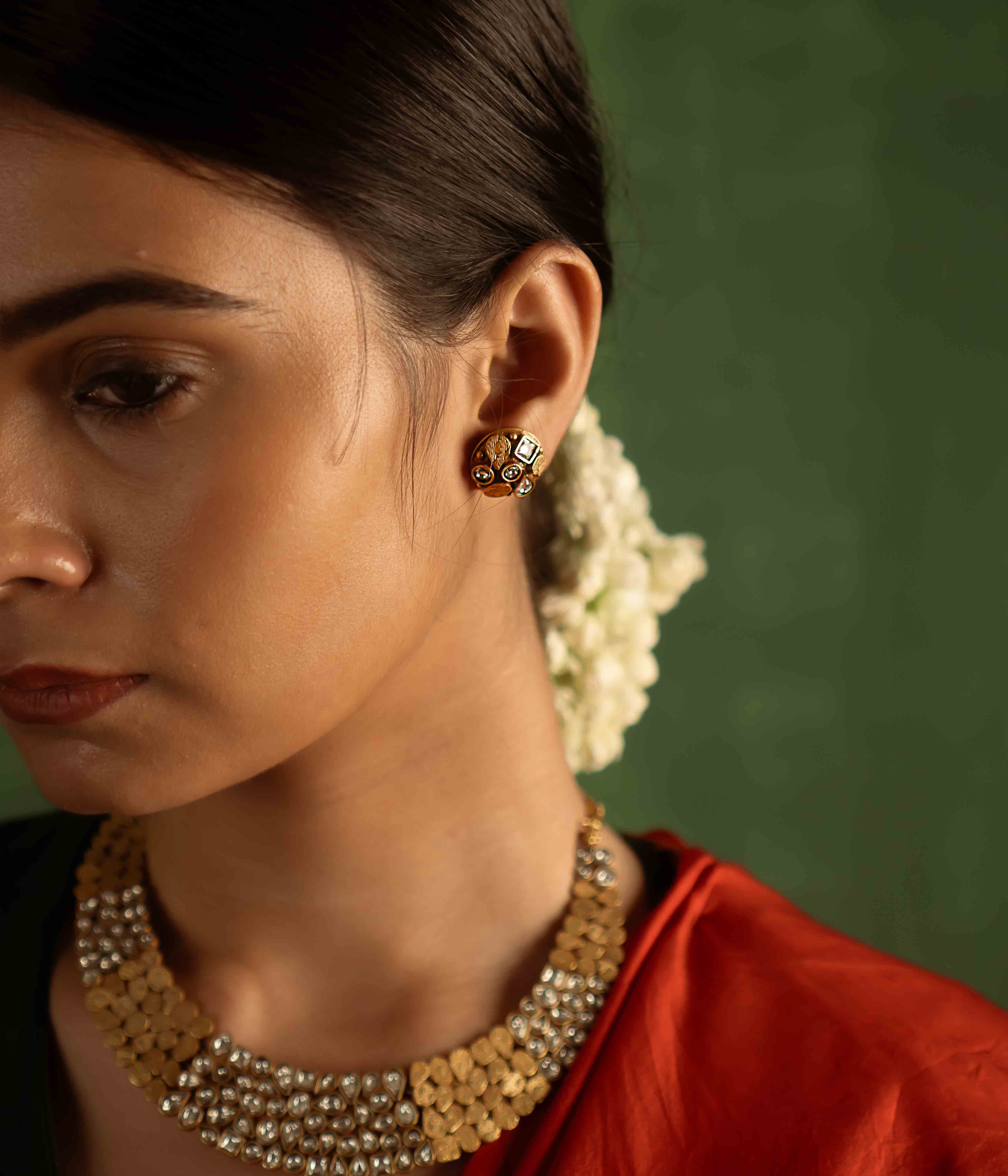 The Kaeya Earrings (gold-plated silver) radiate timeless elegance, with sparkling Polki stones that carry the whispers of heritage into the present.