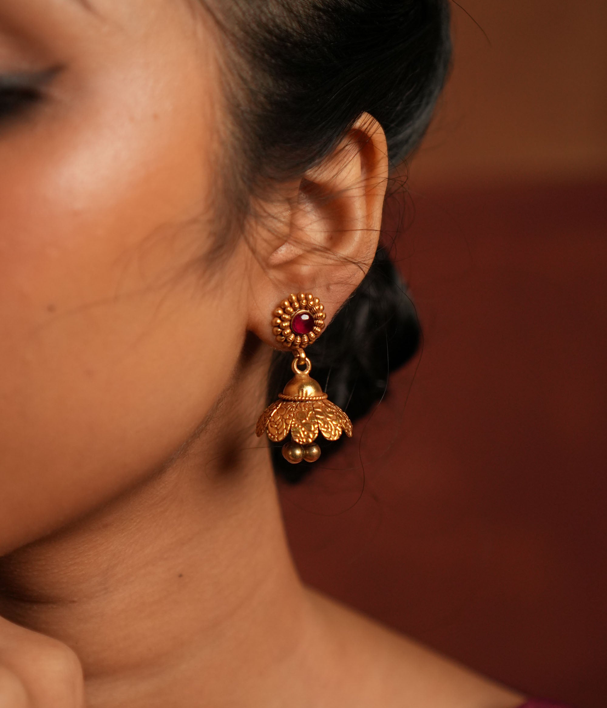 Elegant silver and gold plated Kaia Earrings with vibrant red gemstone