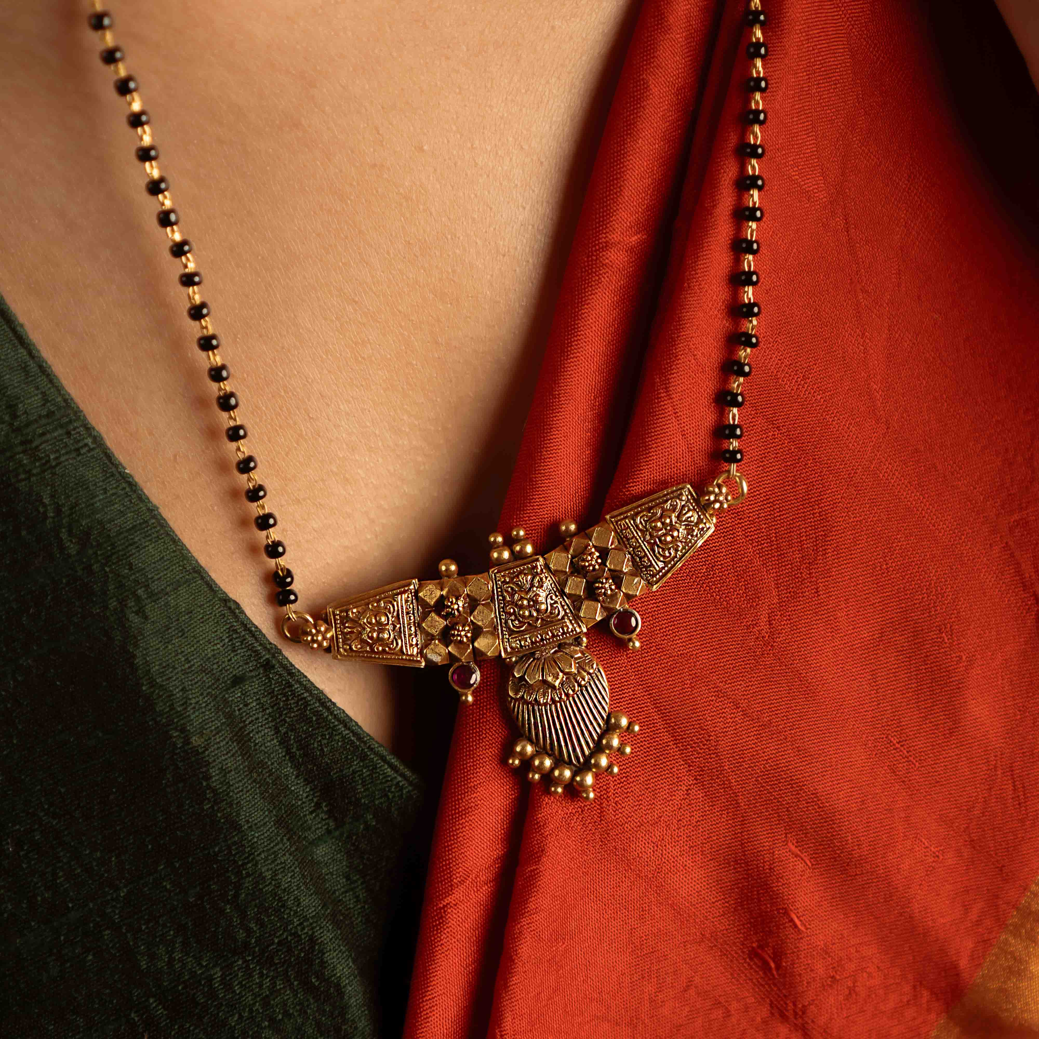 Eternal love reimagined. The Kund-Pushpa mangalsutra, adorned with temple motifs, embodies tradition and heritage—a cherished heirloom symbolizing devotion and commitment.