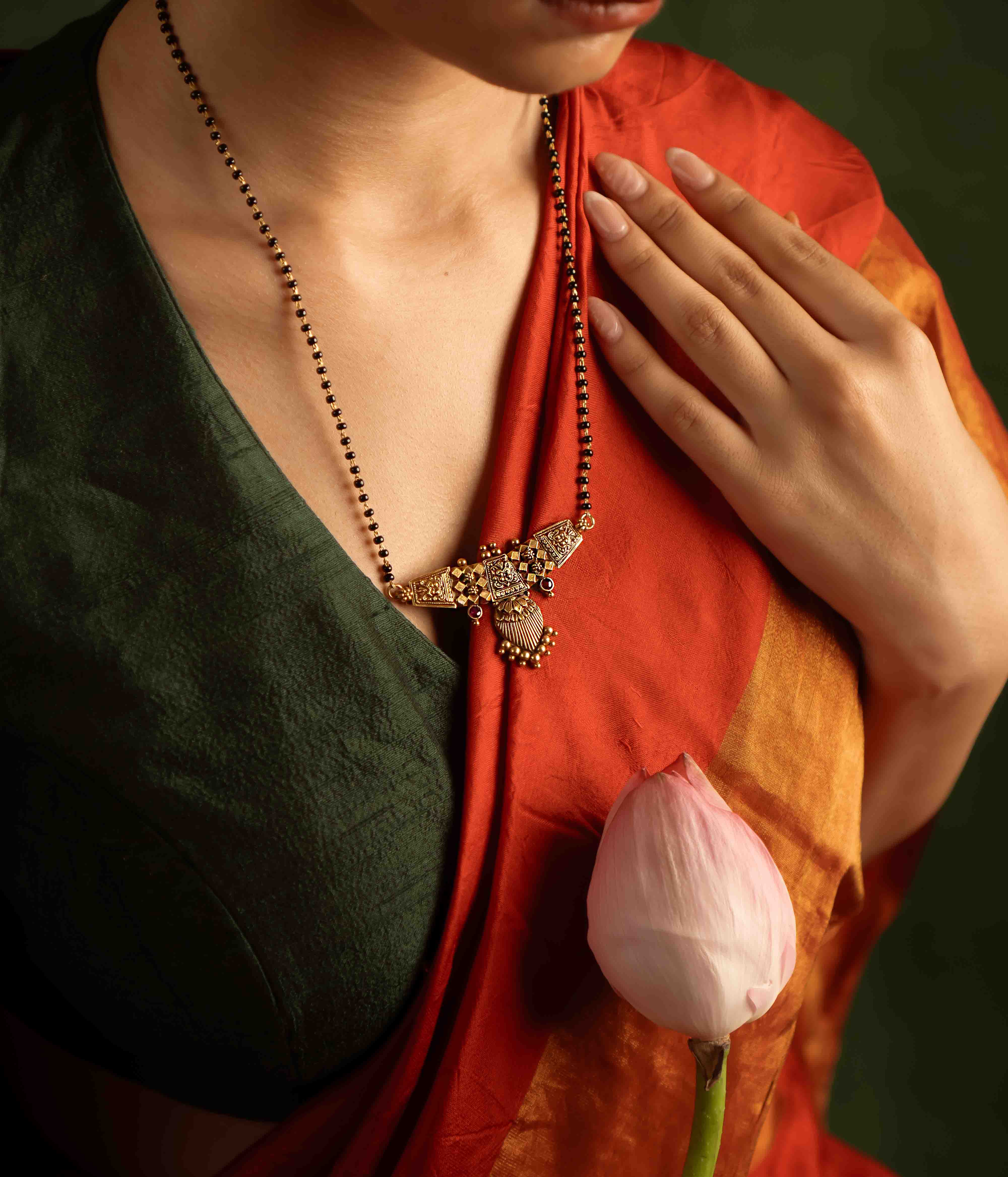 Eternal love reimagined. The Kund-Pushpa mangalsutra, adorned with temple motifs, embodies tradition and heritage—a cherished heirloom symbolizing devotion and commitment.