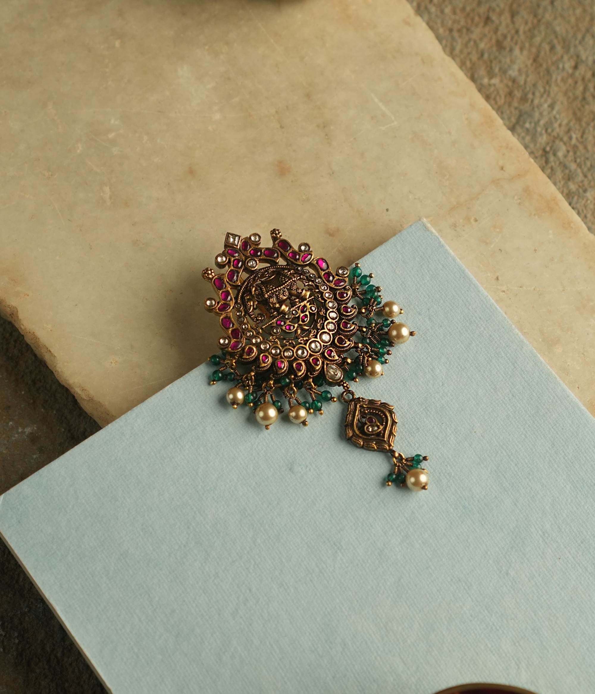 Handmade pendant with white and red Kundan stones