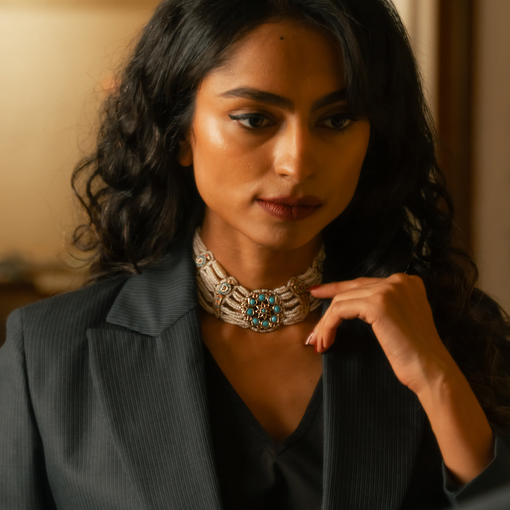 Pearl-woven choker with central turquoise floral motif, ruby accents, and elegant Leelah-style craftsmanship.