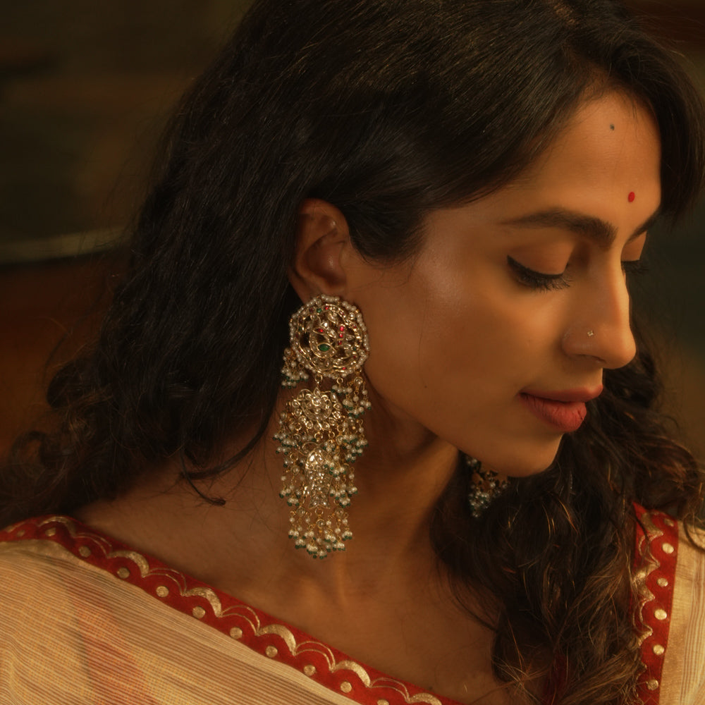 Ornate temple-style earrings with rubies, white sapphires, and pearl clusters from the Leelah collection.