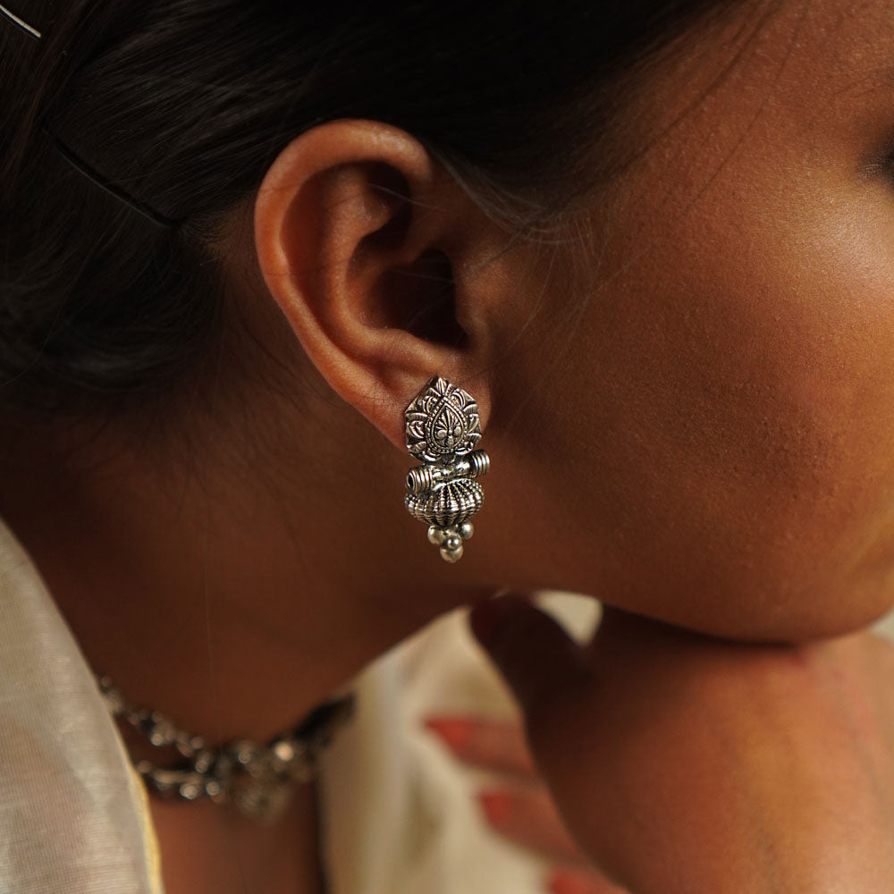 The Laya earrings, designed in oxidized silver, showcase intricate motifs that blend heritage craftsmanship with contemporary elegance—a timeless classic with a modern edge.