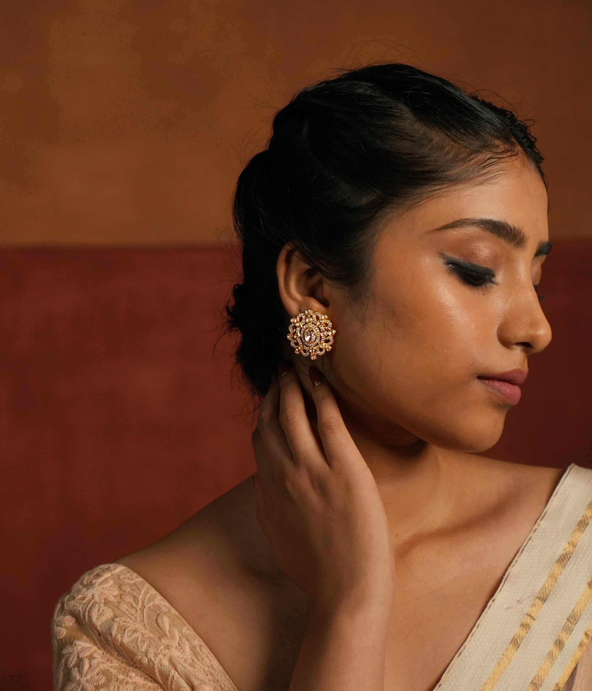 Handmade Polki stud earrings with gold plated rim