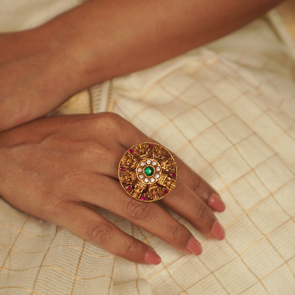 The Lochana Ring: A relic of the past, reborn. Gold-plated silver with temple-inspired motifs and radiant kundans, exuding vintage elegance with a modern charm.