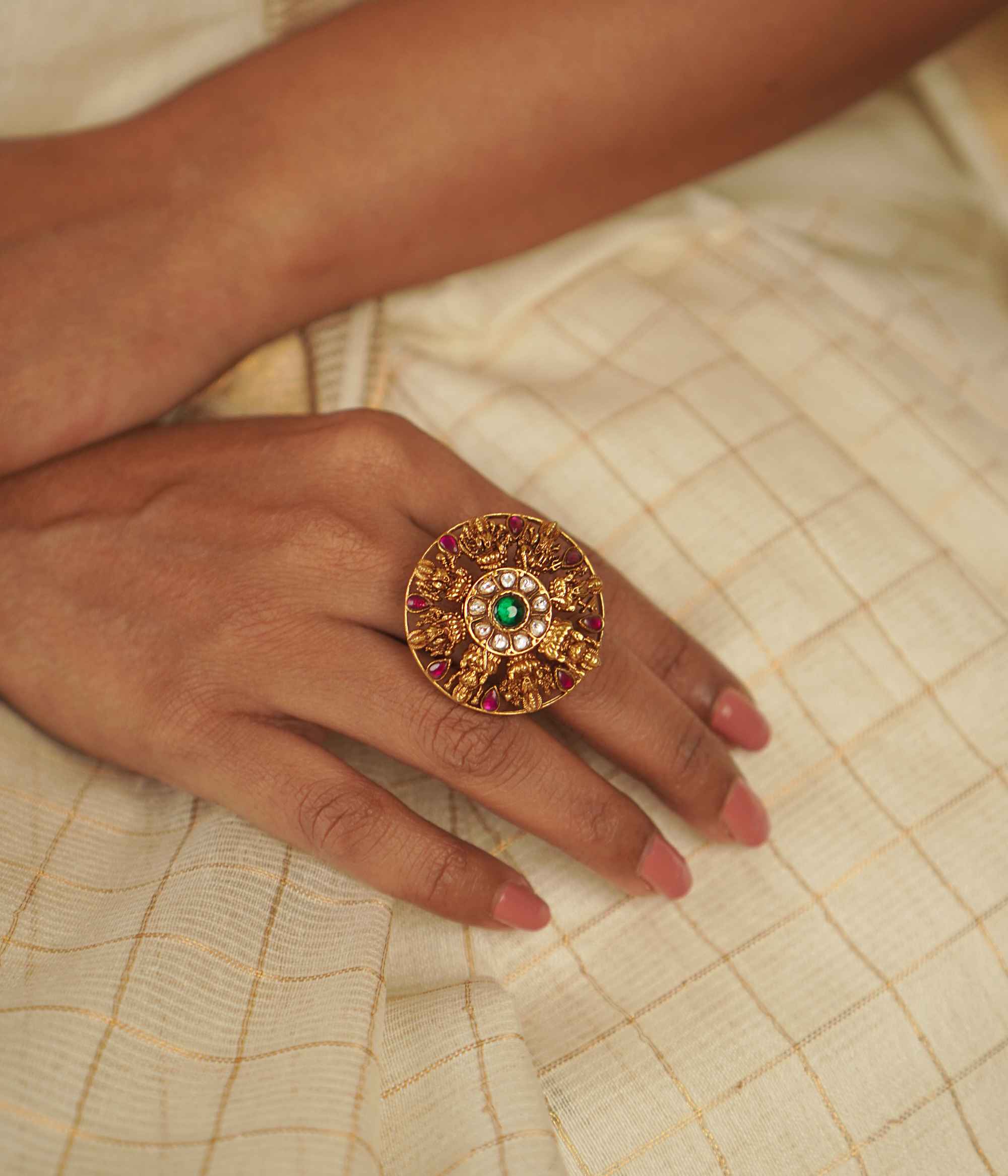 The Lochana Ring: A relic of the past, reborn. Gold-plated silver with temple-inspired motifs and radiant kundans, exuding vintage elegance with a modern charm.