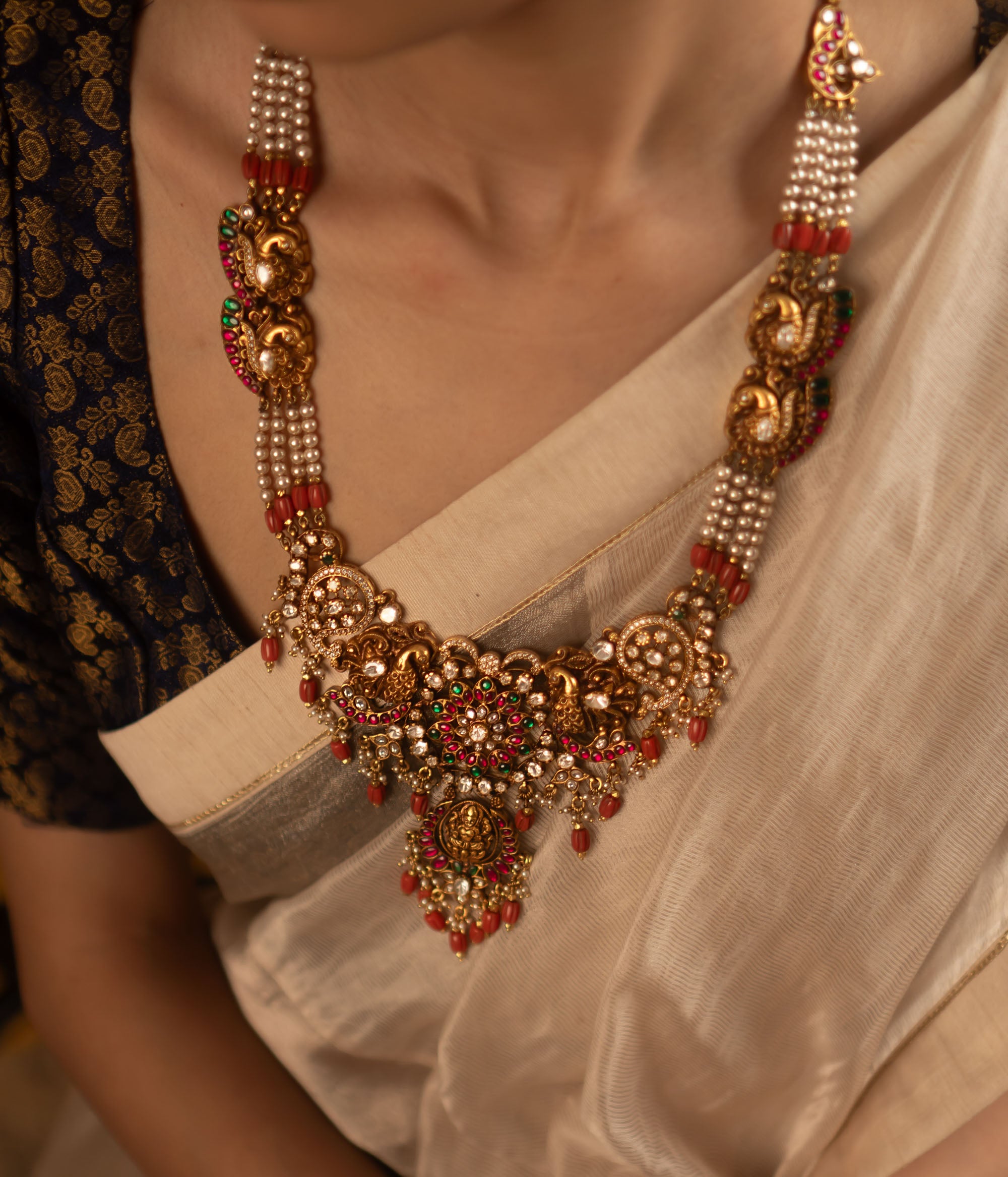 Traditional Bridal Necklace with Kundan Stones and Red Beads for Festive Wear